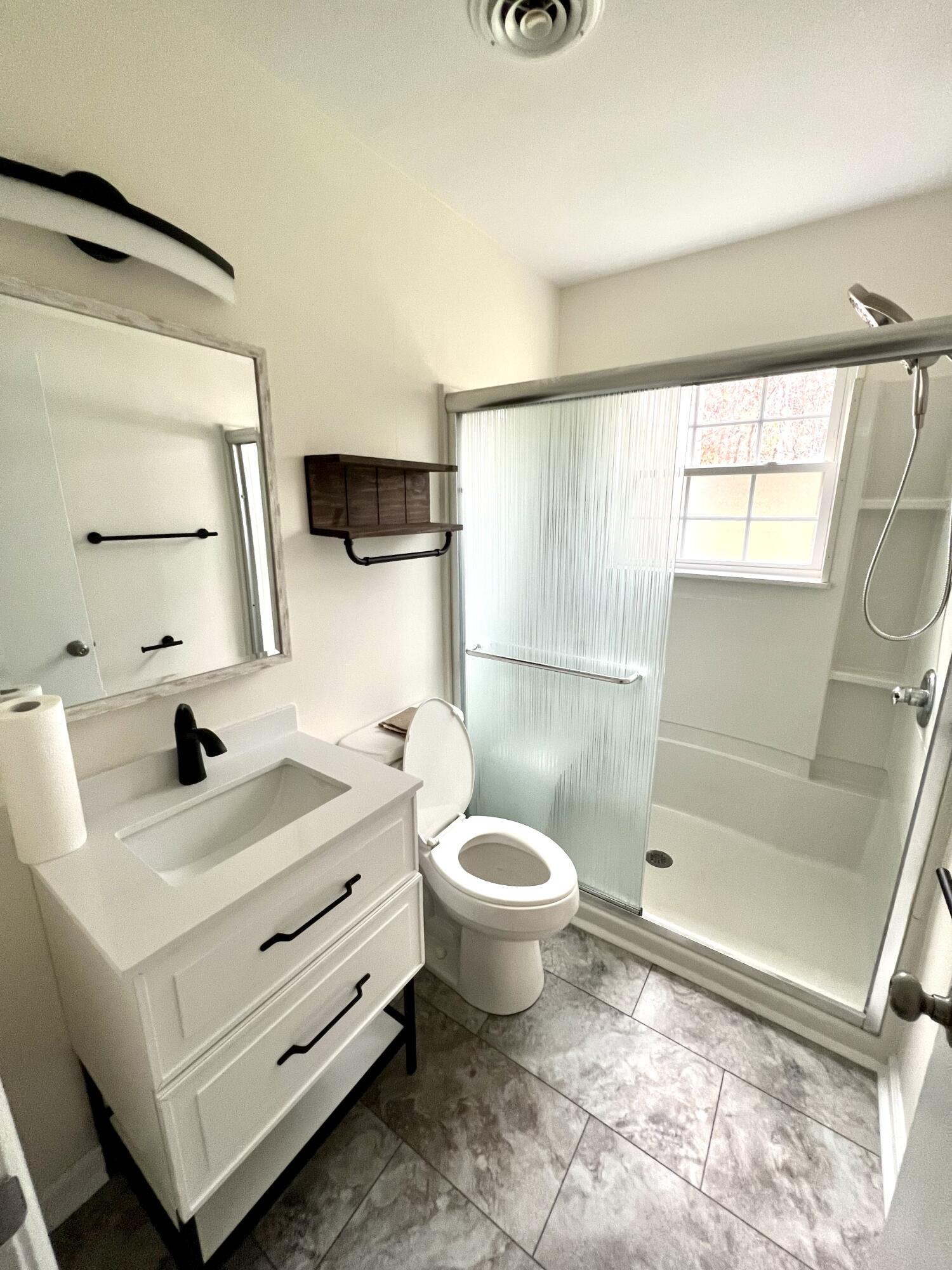 5721 Green Ridge Road Roanoke, VA 24019 - Photo 10 of 16 a bathroom with a sink toilet and shower