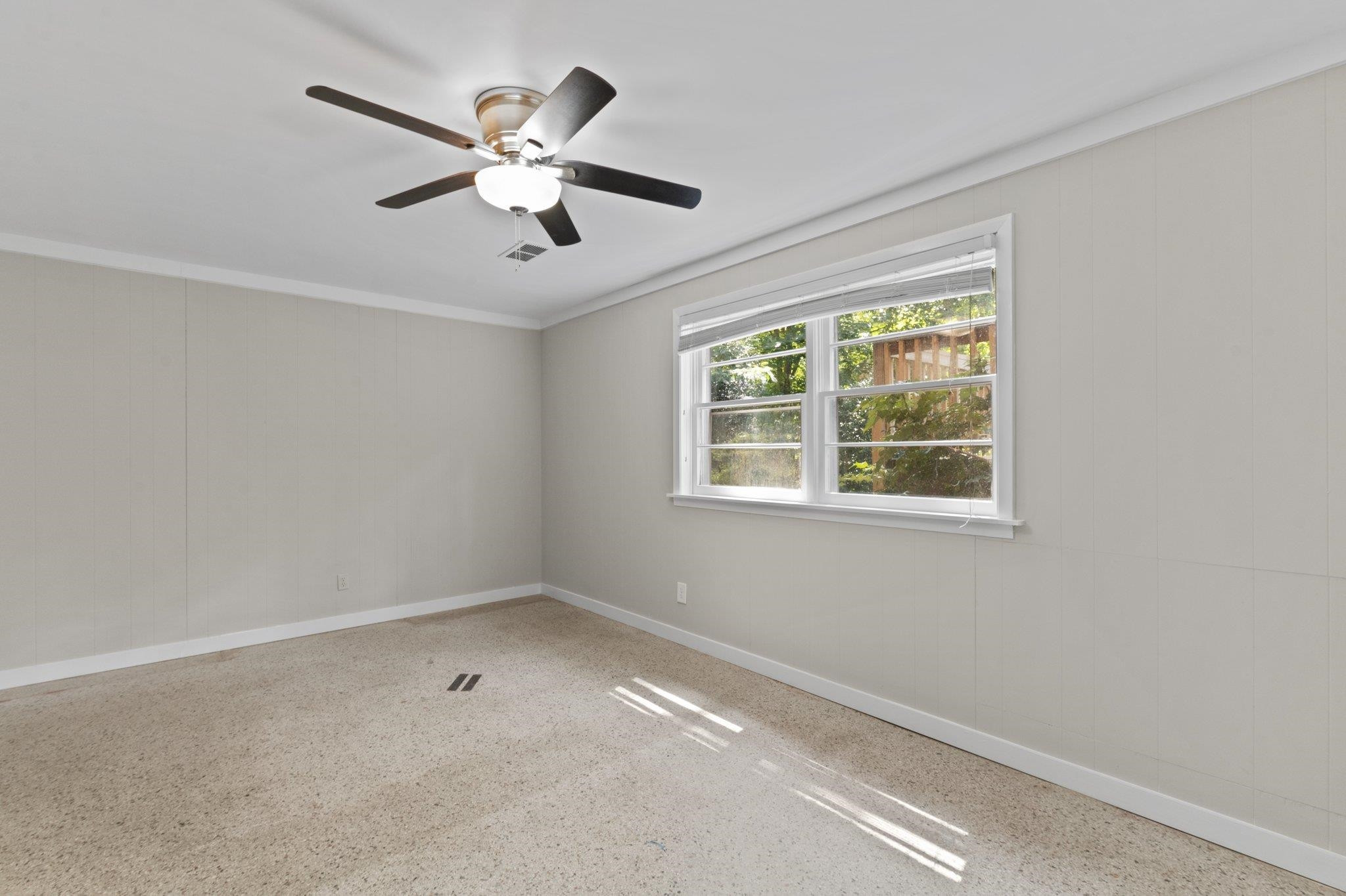 3605 Octavia Street Raleigh, NC 27606 - Photo 14 of 50 a view of an empty room with a window