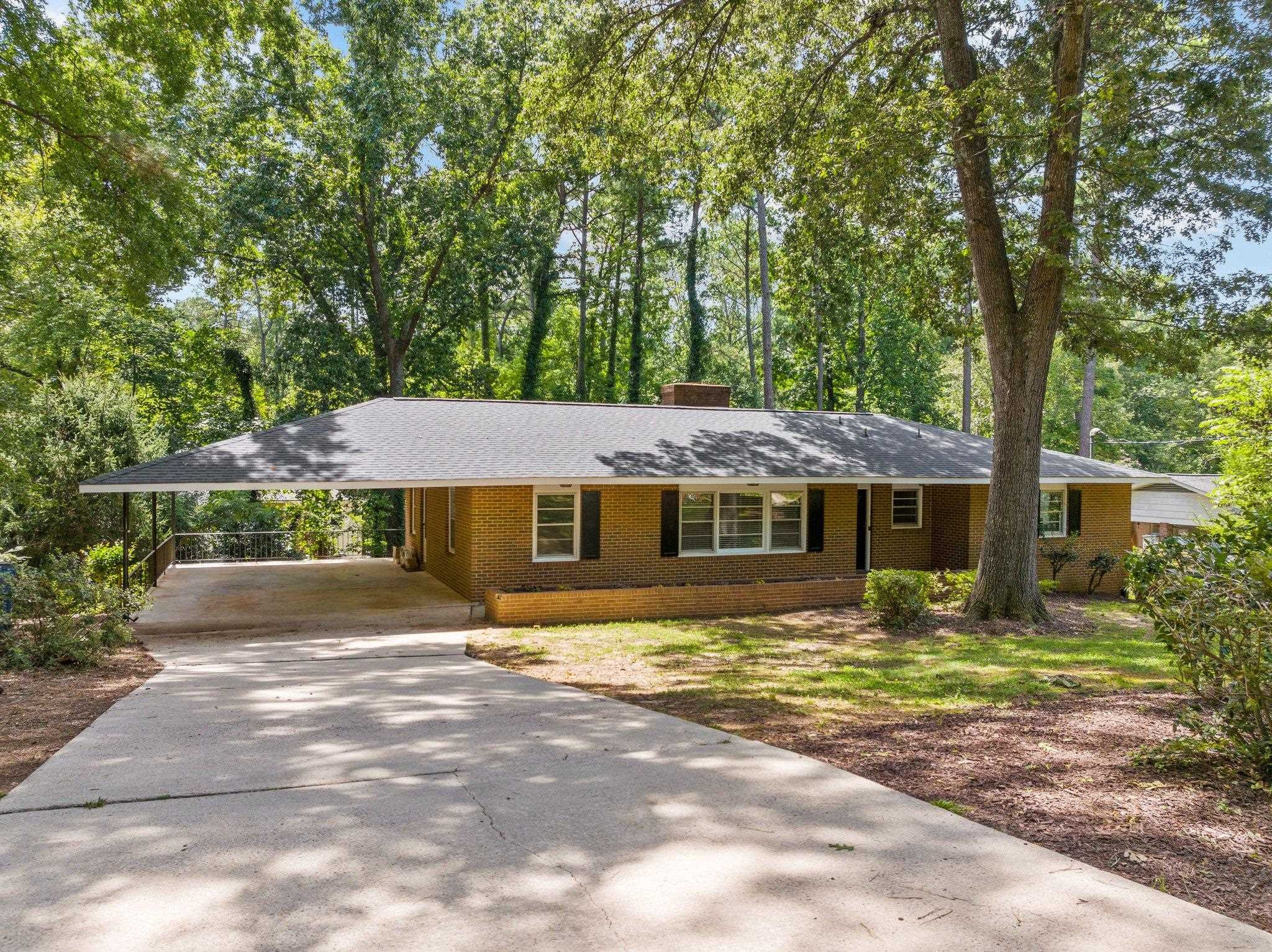 3605 Octavia Street Raleigh, NC 27606 - Photo 18 of 50 a front view of a house with a yard