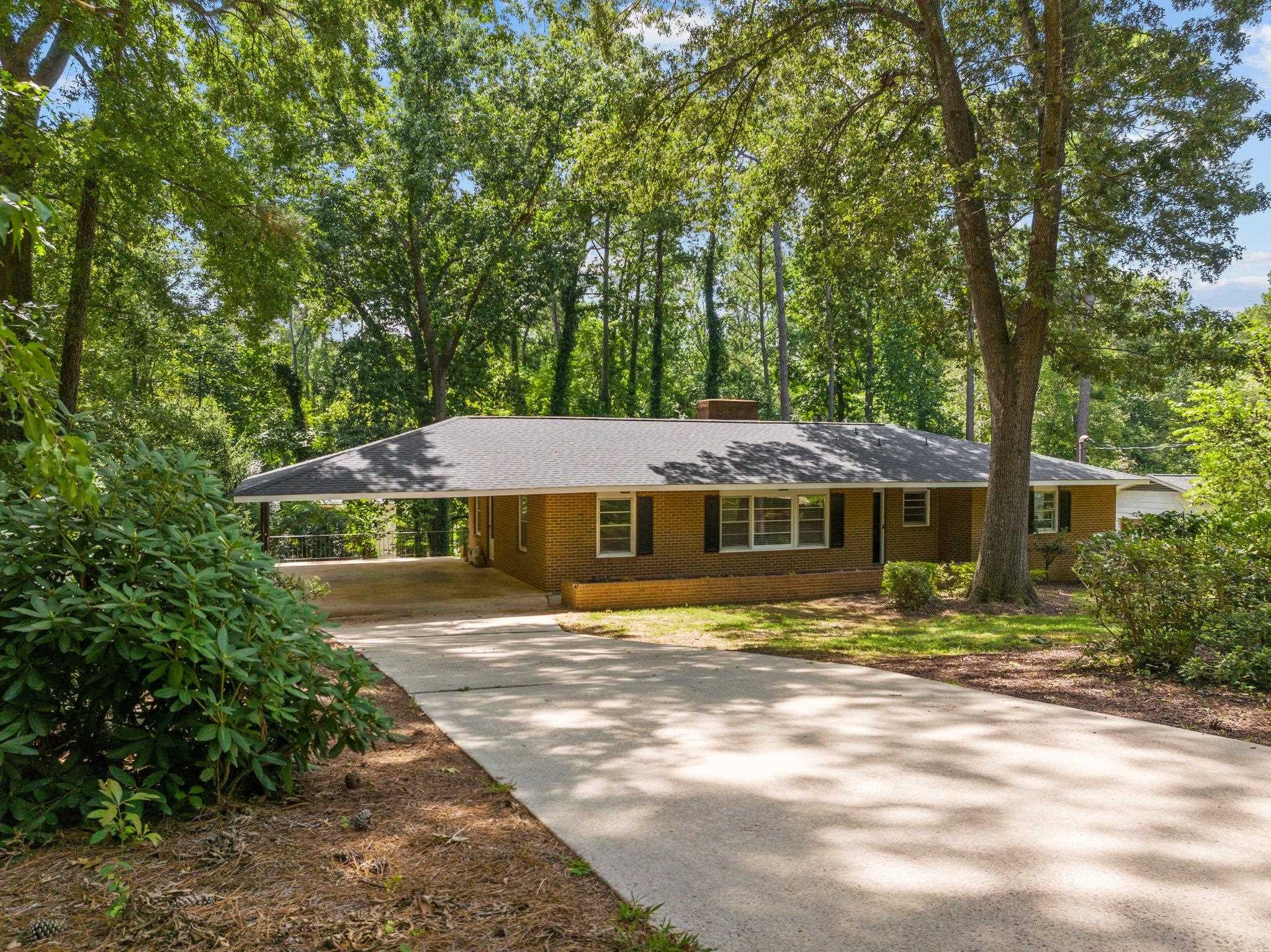 3605 Octavia Street Raleigh, NC 27606 - Photo 20 of 50 a front view of a house with a yard
