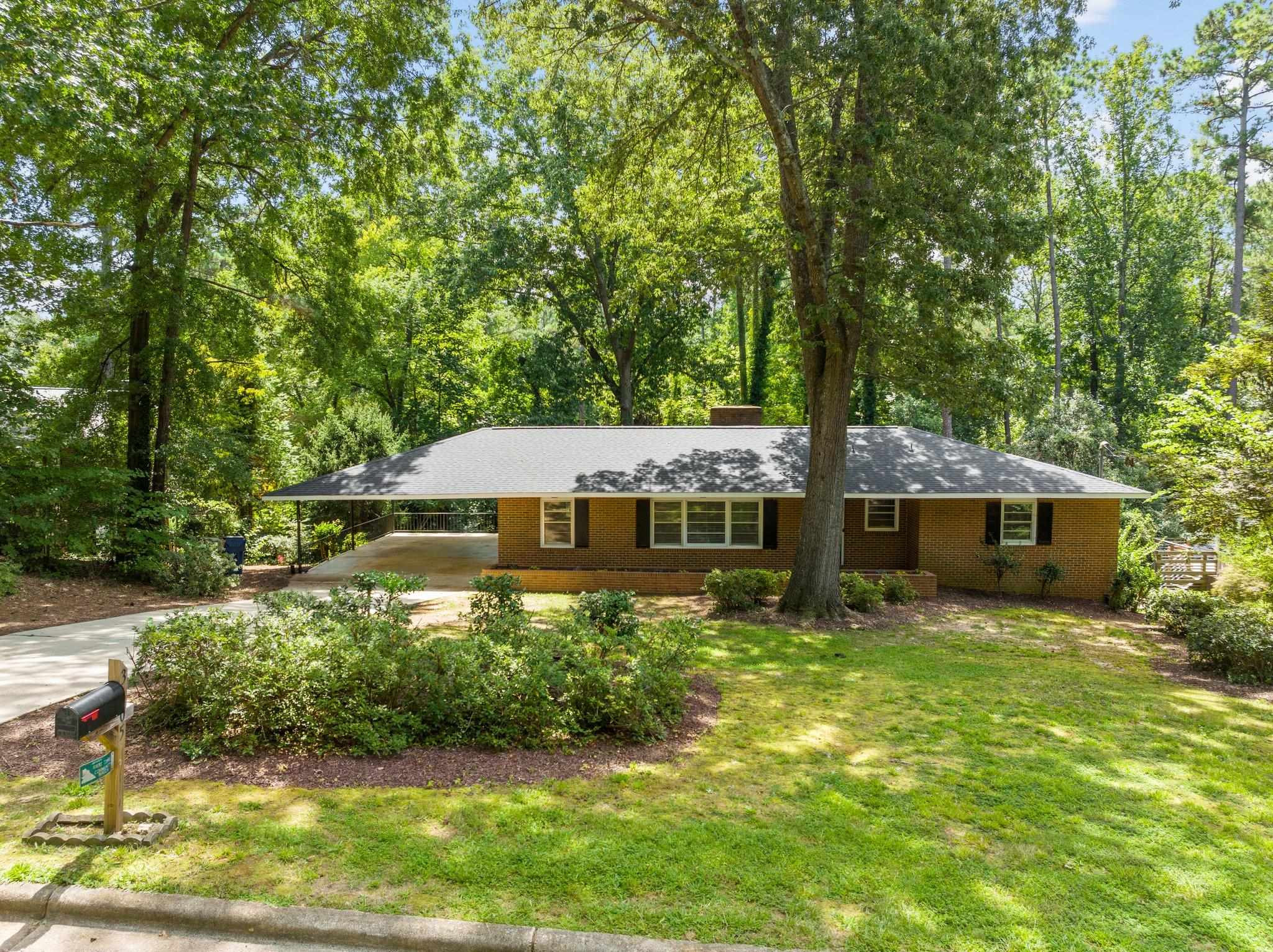 3605 Octavia Street Raleigh, NC 27606 - Photo 21 of 50 front view of a house with a yard