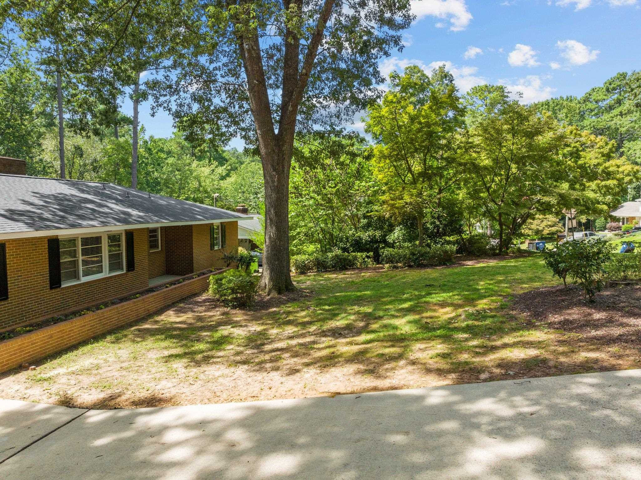 3605 Octavia Street Raleigh, NC 27606 - Photo 22 of 50 a view of a house with backyard and tree