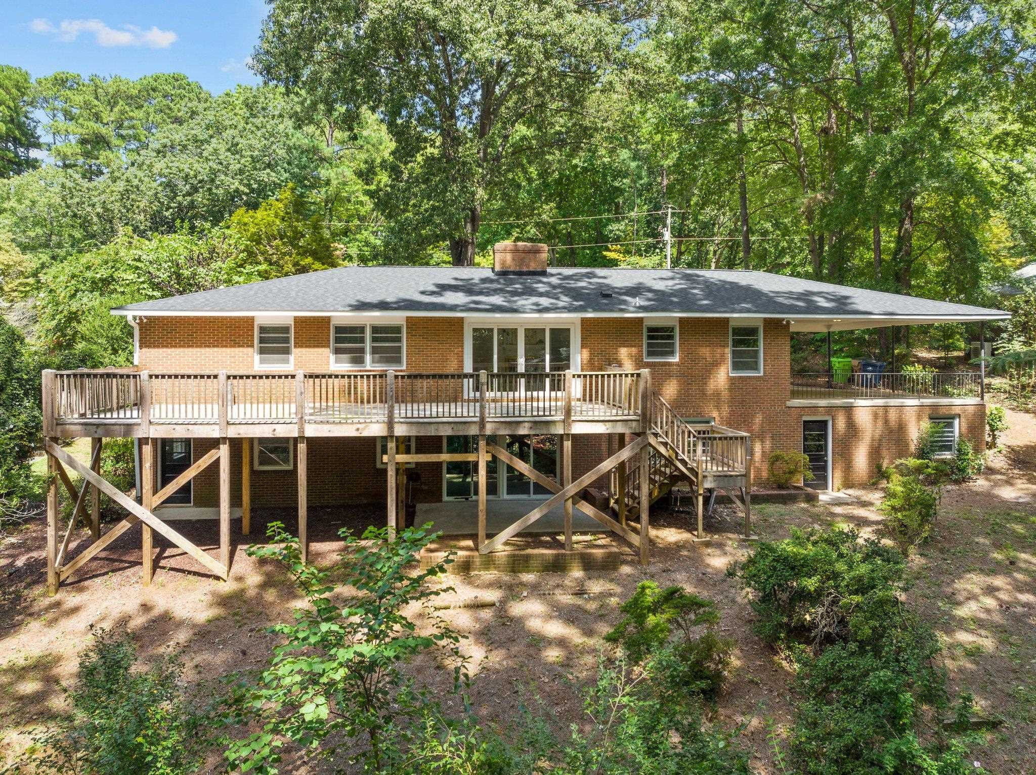 3605 Octavia Street Raleigh, NC 27606 - Photo 25 of 50 a view of a house with a yard