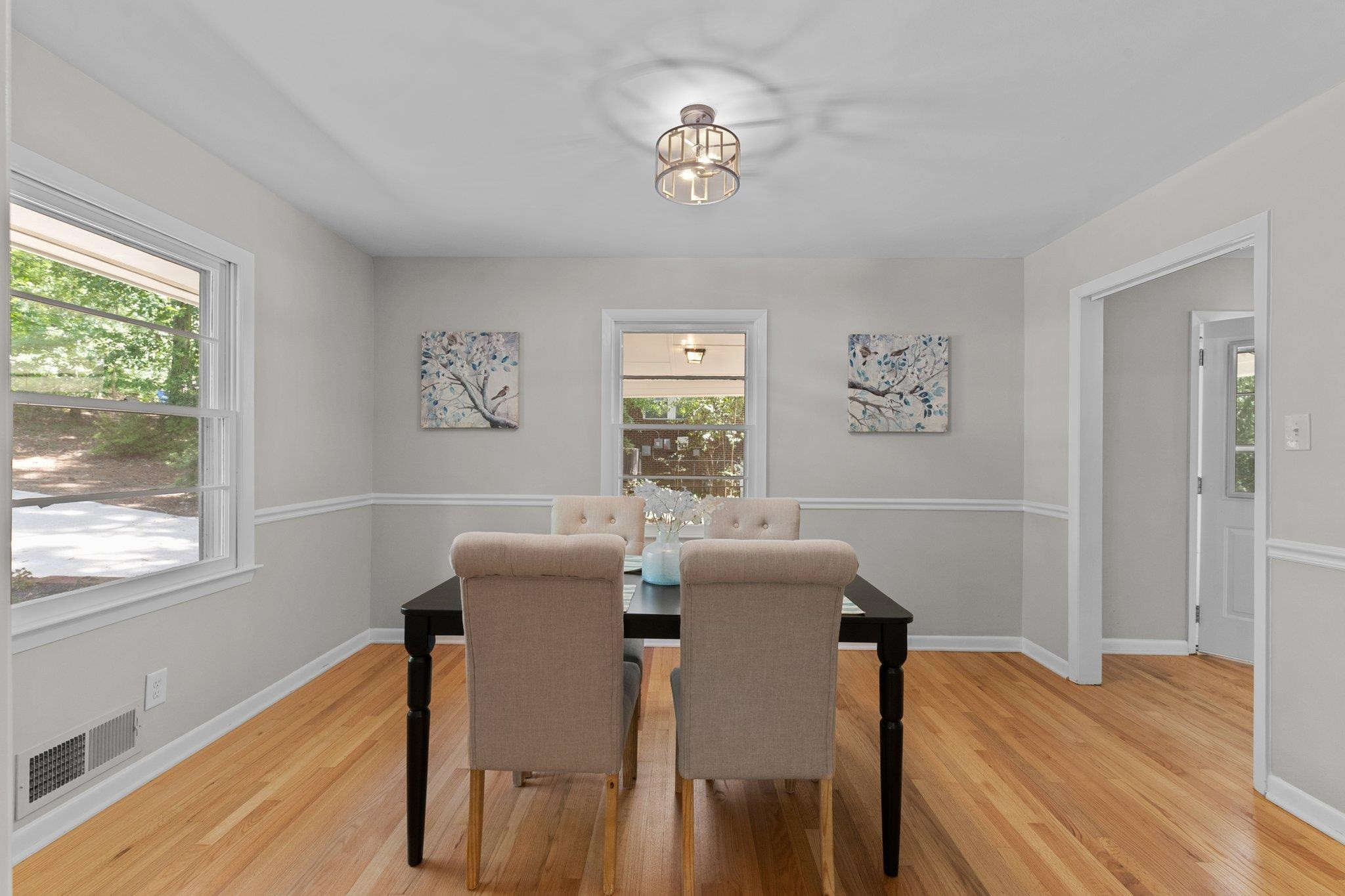 3605 Octavia Street Raleigh, NC 27606 - Photo 3 of 50 a view of a dining room with furniture window and wooden floor