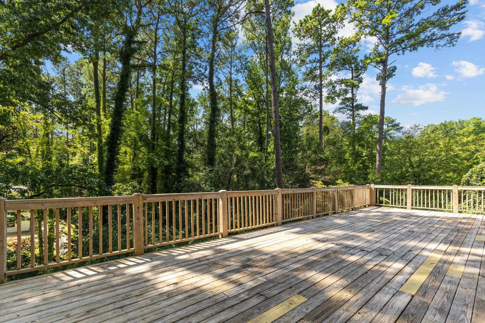 3605 Octavia Street Raleigh, NC 27606 - Photo 31 of 50 a balcony with trees in front of it