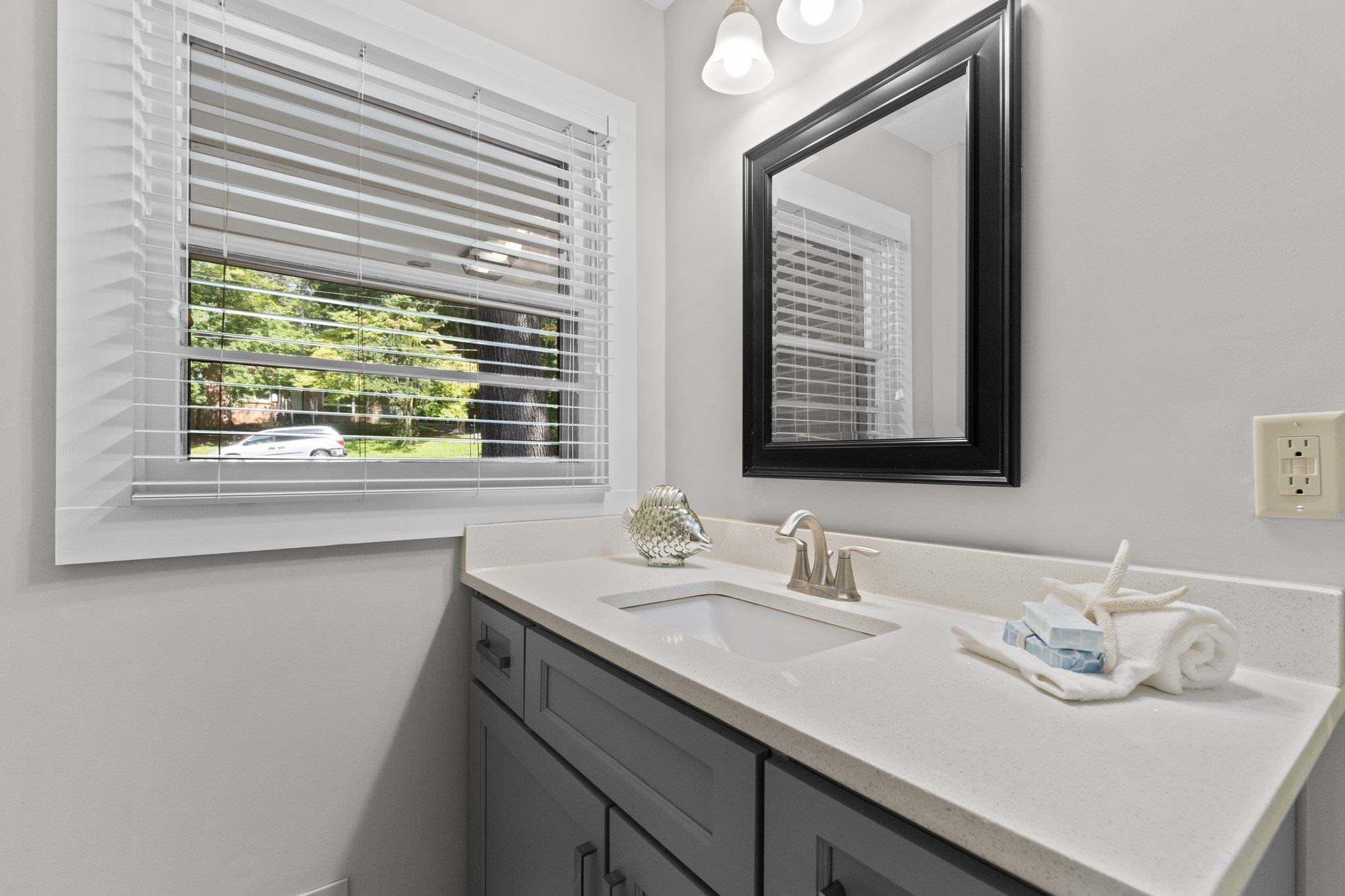 3605 Octavia Street Raleigh, NC 27606 - Photo 41 of 50 a bathroom with a sink double vanity and a window