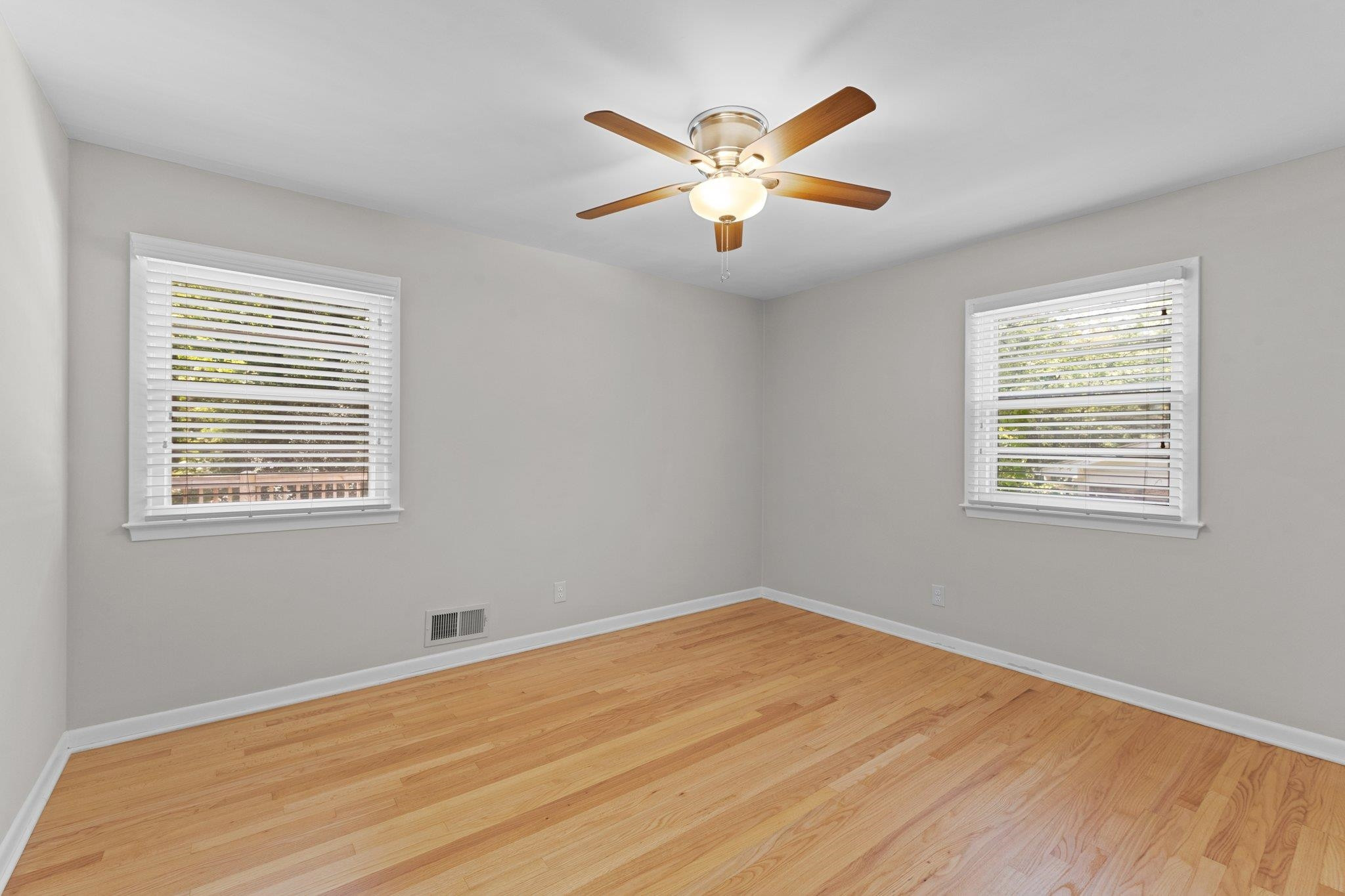 3605 Octavia Street Raleigh, NC 27606 - Photo 45 of 50 a view of a room with wooden floor and window