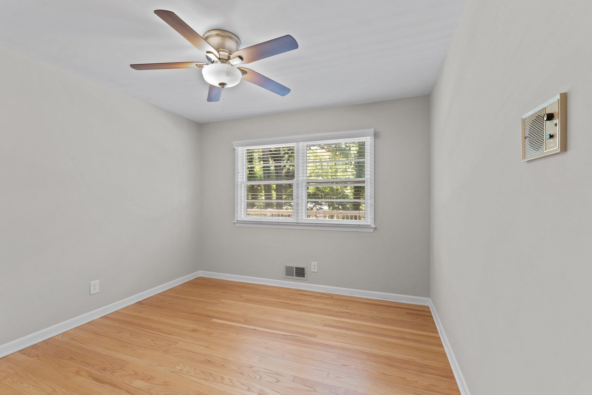 3605 Octavia Street Raleigh, NC 27606 - Photo 46 of 50 an empty room with fan and windows