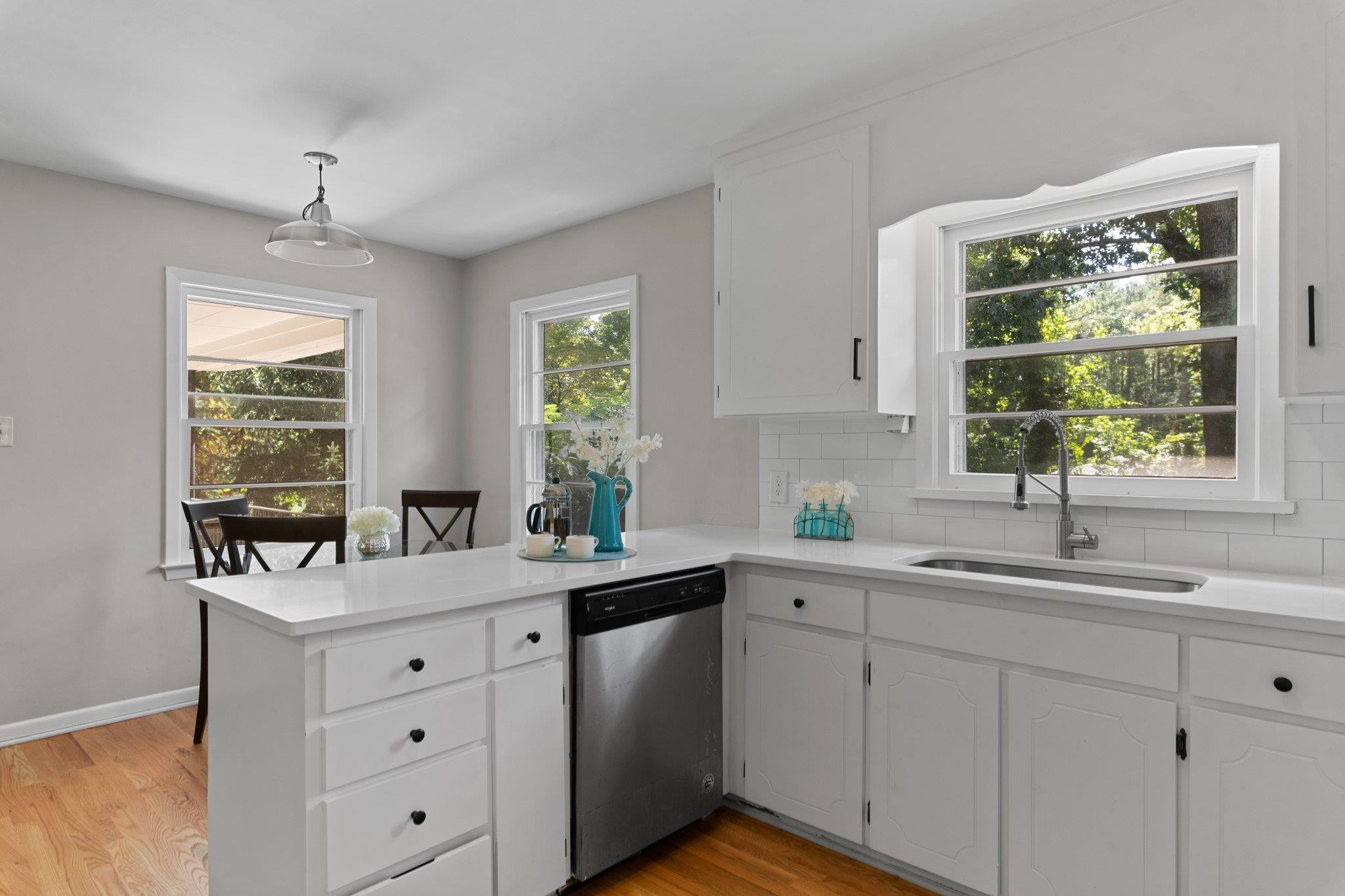 3605 Octavia Street Raleigh, NC 27606 - Photo 8 of 50 a kitchen with sink cabinets and window