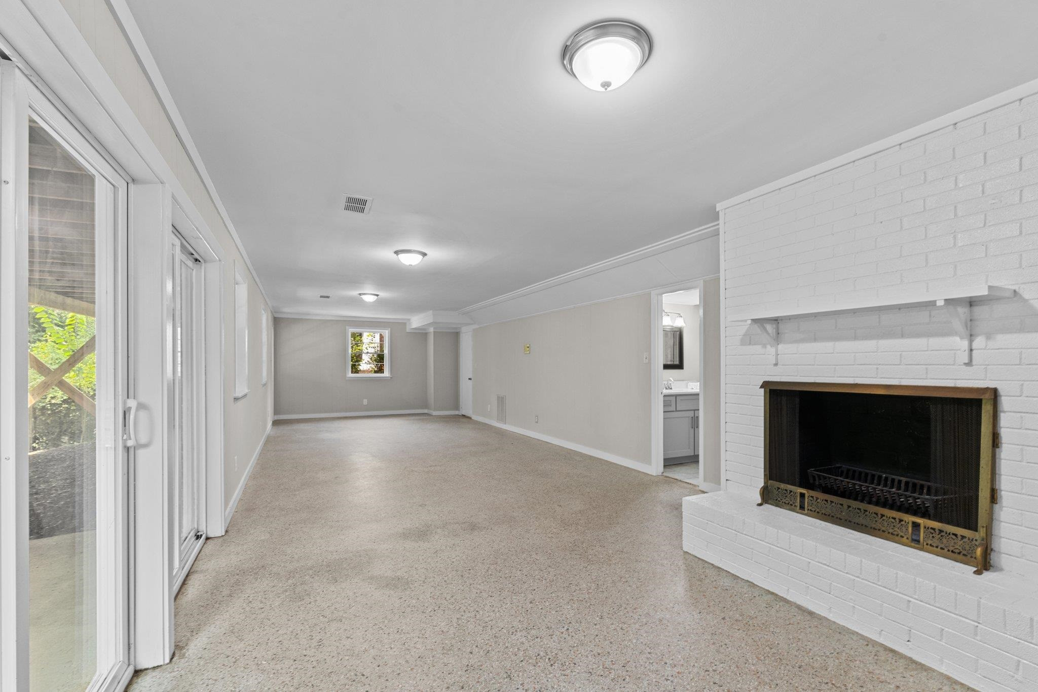 3605 Octavia Street Raleigh, NC 27606 - Photo 10 of 50 a view of a livingroom with a fireplace and window
