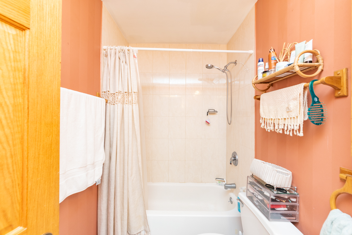 2932 North Ridgeway Avenue, Unit 1 Chicago, IL 60618 - Photo 13 of 25 a bathroom with a bathtub and a shower