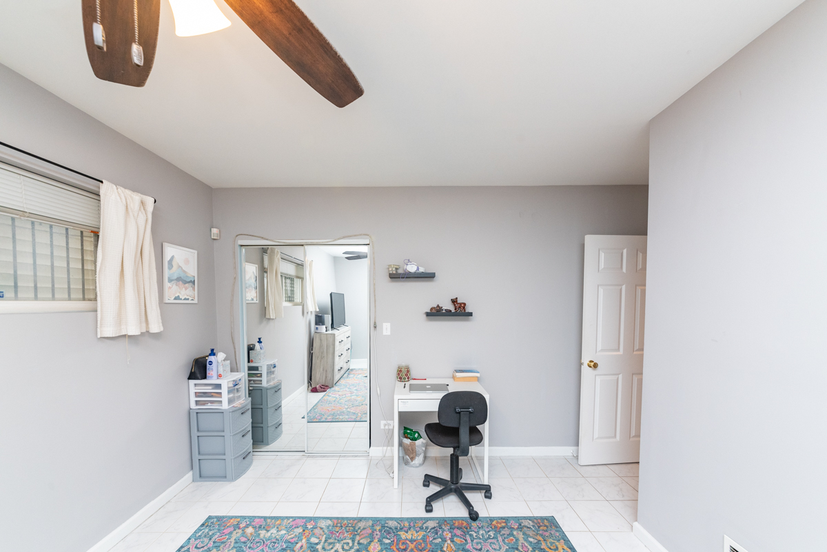 2932 North Ridgeway Avenue, Unit 1 Chicago, IL 60618 - Photo 18 of 25 a living room with furniture and a painting on the wall