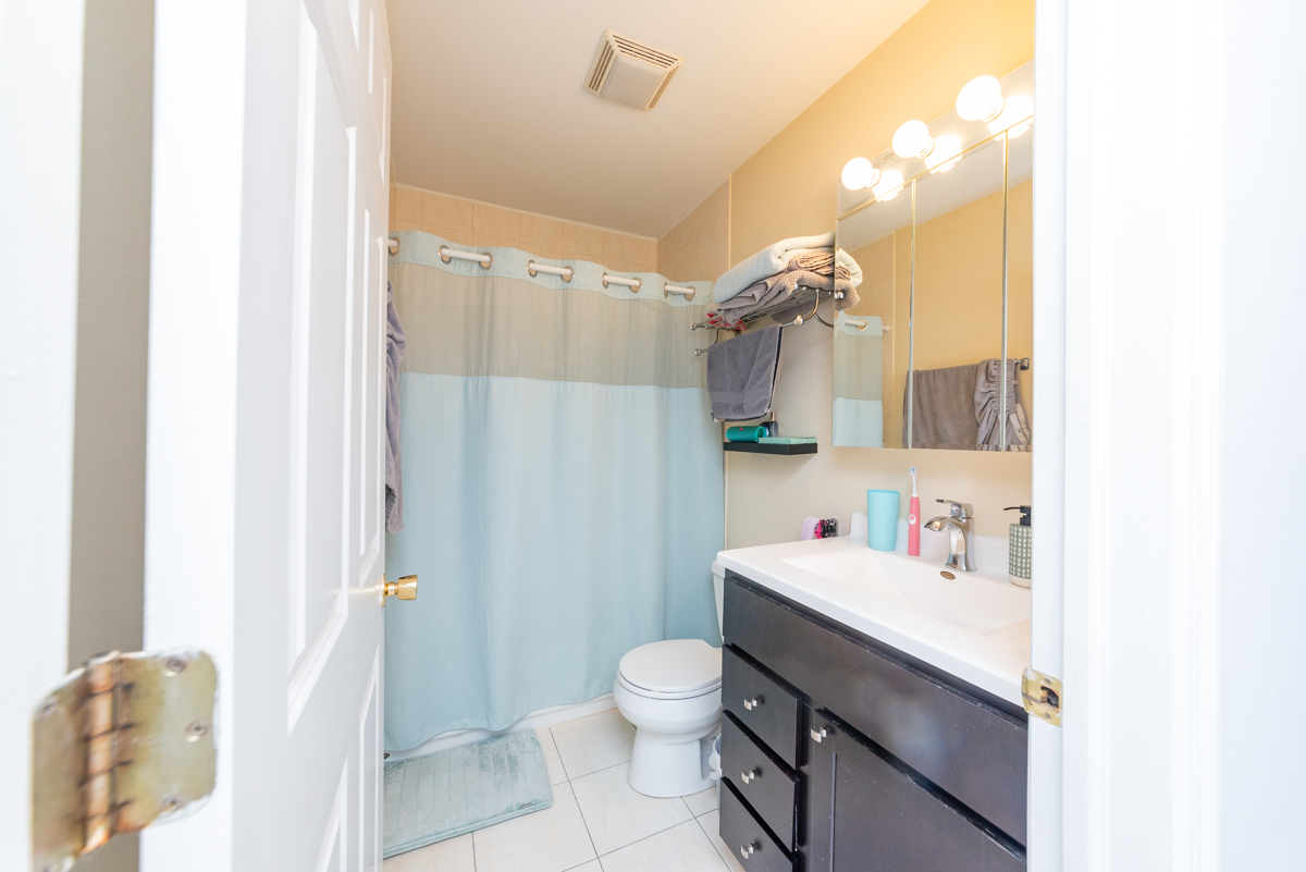2932 North Ridgeway Avenue, Unit 1 Chicago, IL 60618 - Photo 19 of 25 a bathroom with a sink a toilet and shower