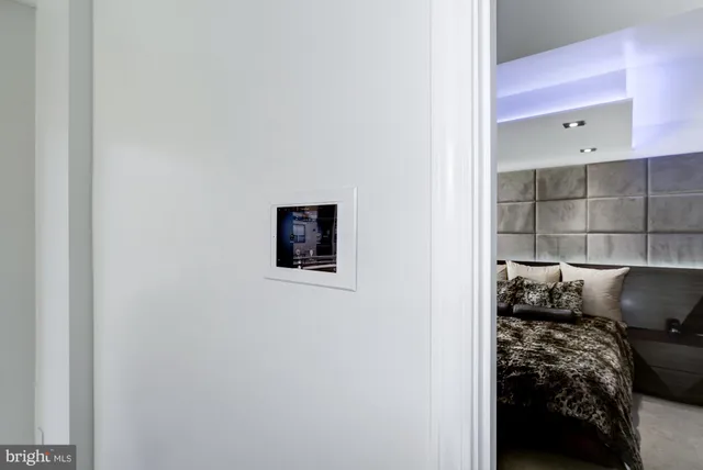 a bed room with a bed and a view of bedroom