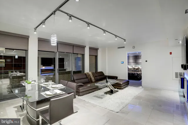 a kitchen with stainless steel appliances kitchen island granite countertop a sink and cabinets