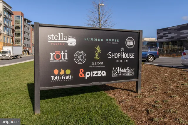 a view of a food market with retail shops