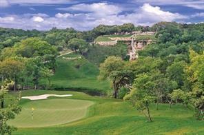 a view of a lake with a building in the background