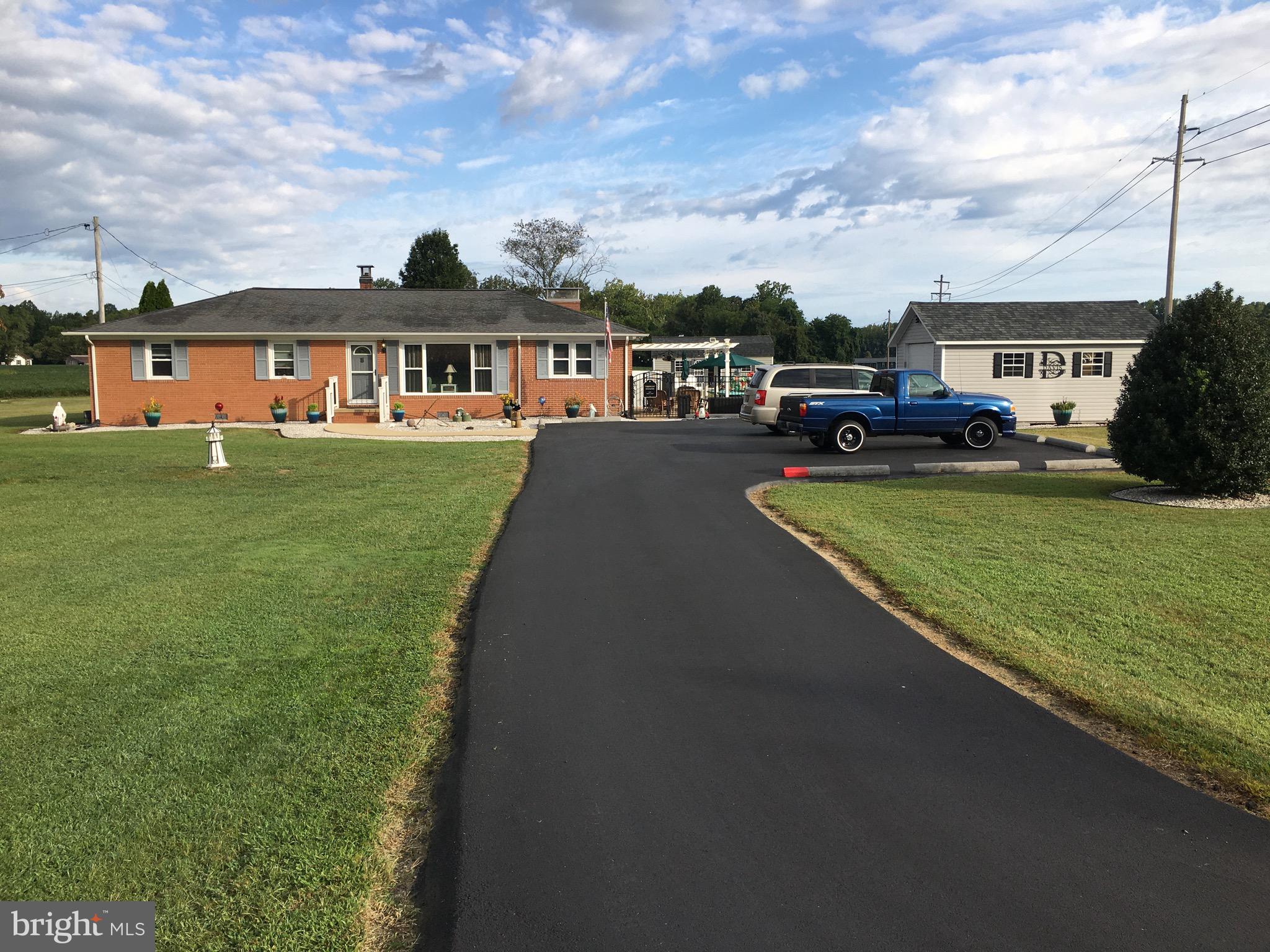 39030 Chaptico Road Mechanicsville, MD 20659 - Photo 1 of 23 a front view of a house with garden