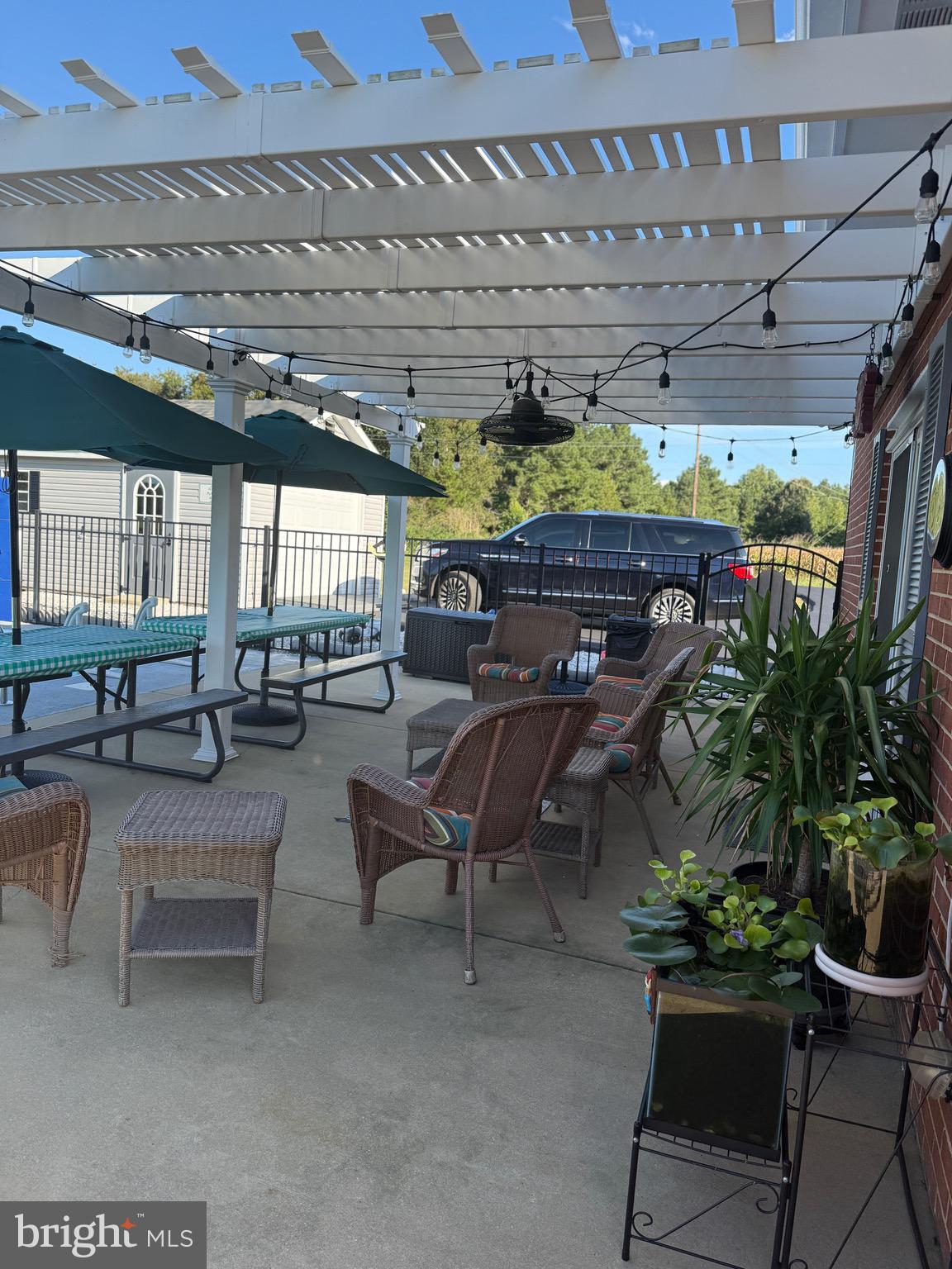 39030 Chaptico Road Mechanicsville, MD 20659 - Photo 19 of 23 a room with lots of potted plants and a table