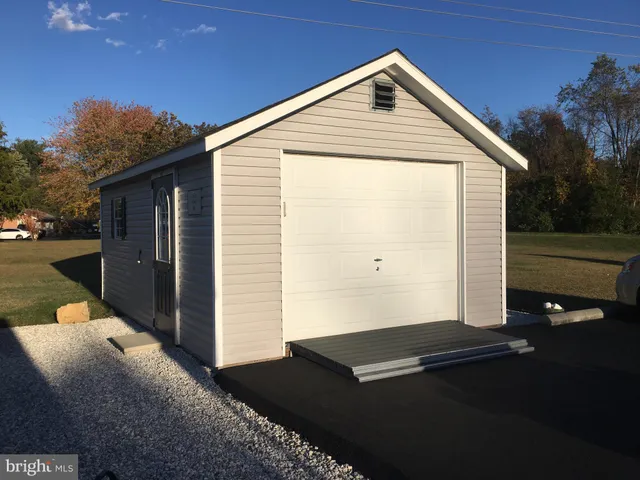a backyard of a house with wooden fence