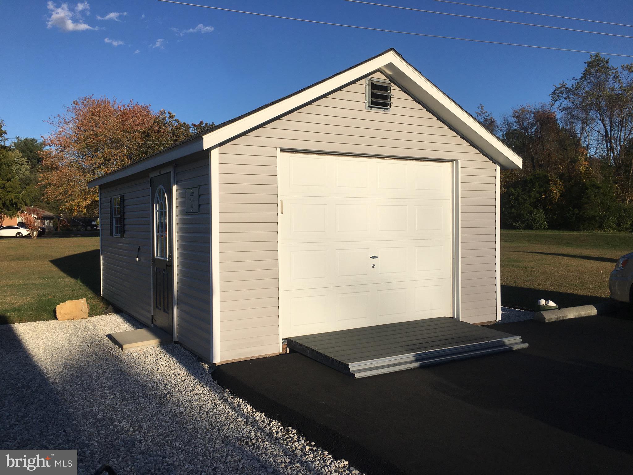 39030 Chaptico Road Mechanicsville, MD 20659 - Photo 5 of 23 a backyard of a house with wooden fence