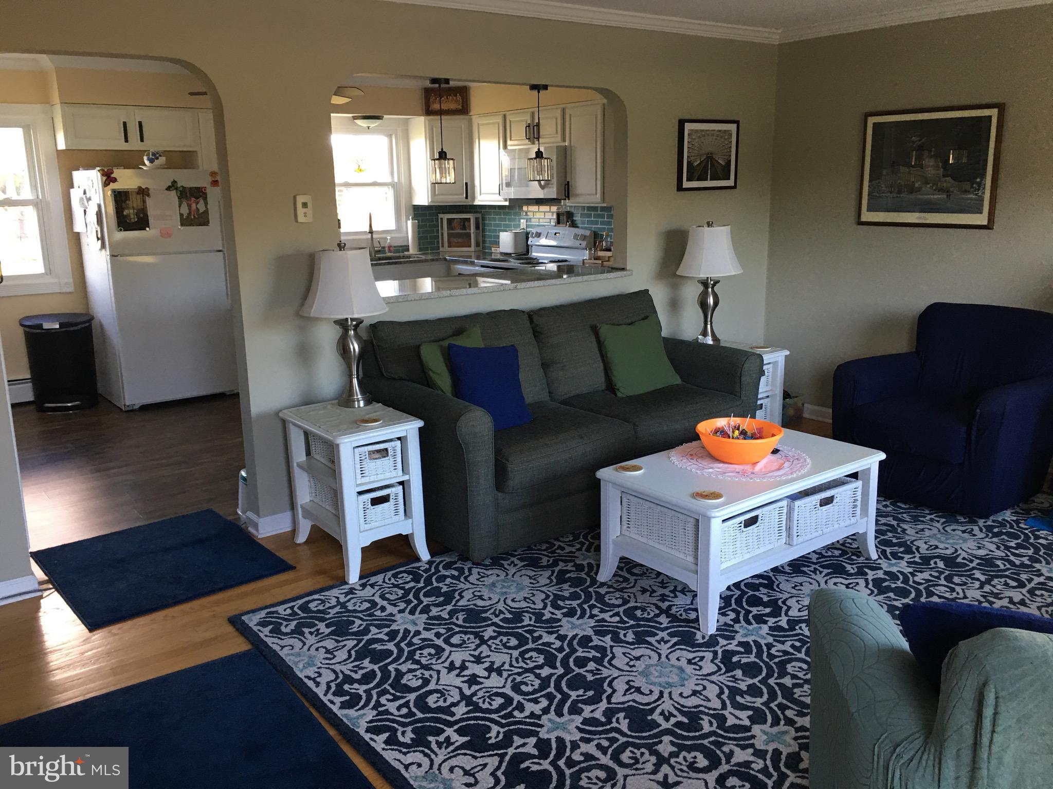 39030 Chaptico Road Mechanicsville, MD 20659 - Photo 8 of 23 a living room with a couch and a table in it