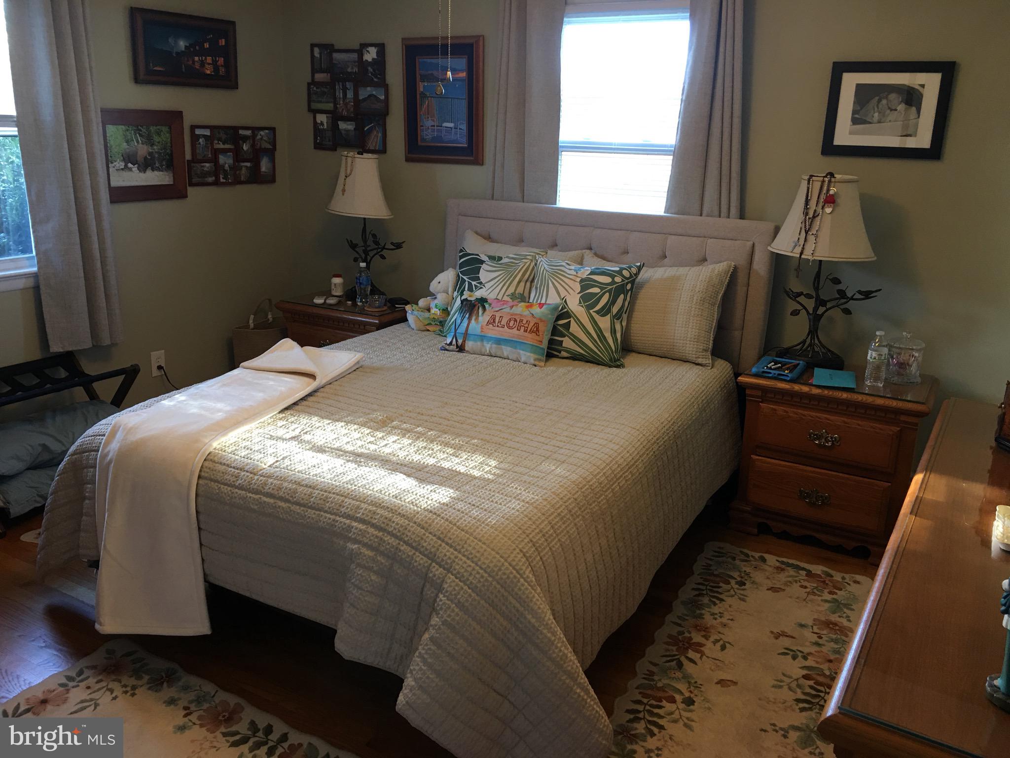 39030 Chaptico Road Mechanicsville, MD 20659 - Photo 9 of 23 a bed sitting in a bedroom next to a window