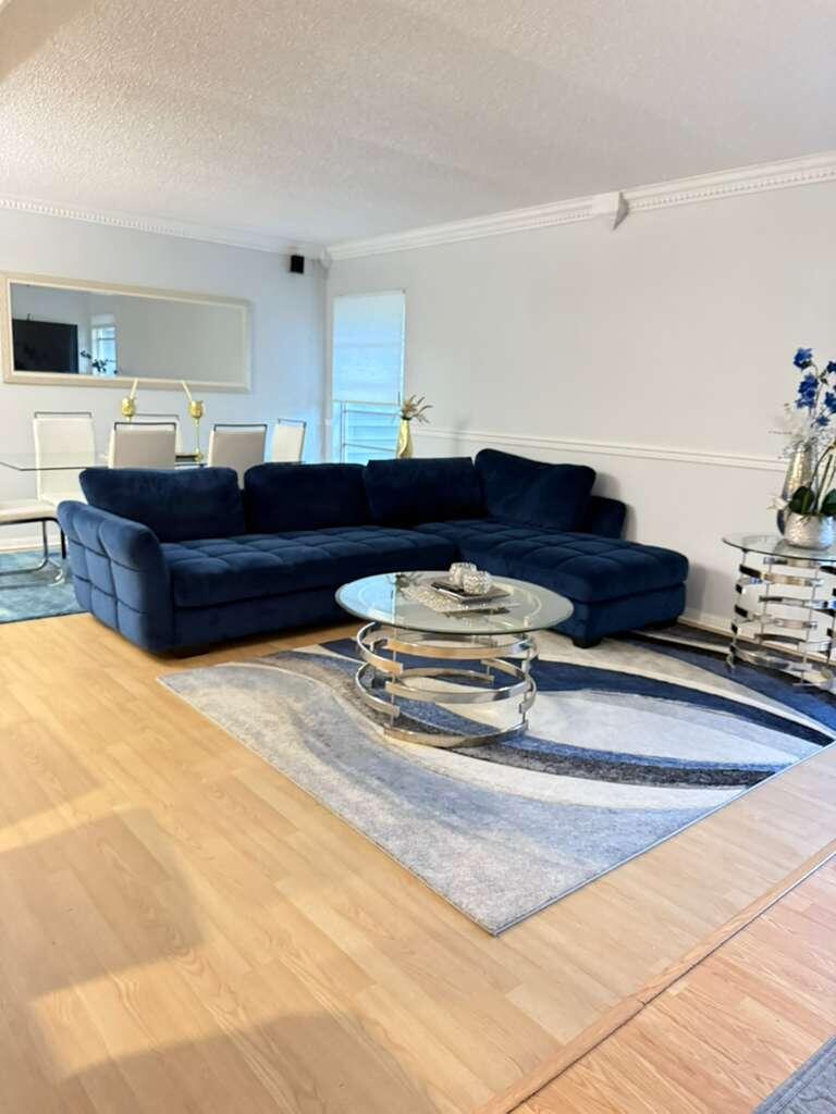 7024 Northwest 63rd Street Tamarac, FL 33321 - Photo 11 of 50 a living room with a couch and dresser