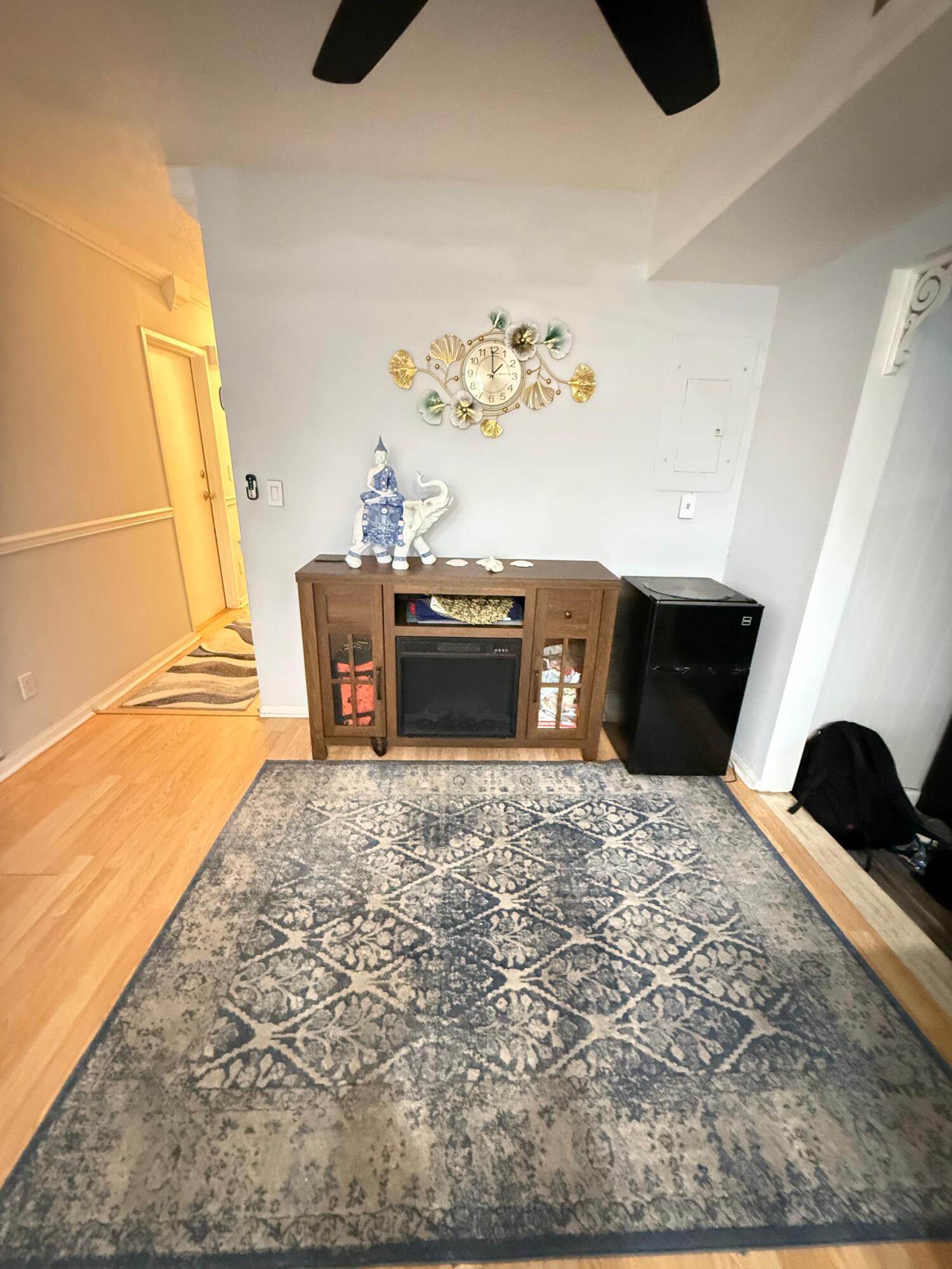 7024 Northwest 63rd Street Tamarac, FL 33321 - Photo 21 of 50 a bedroom with a bed and wooden floor