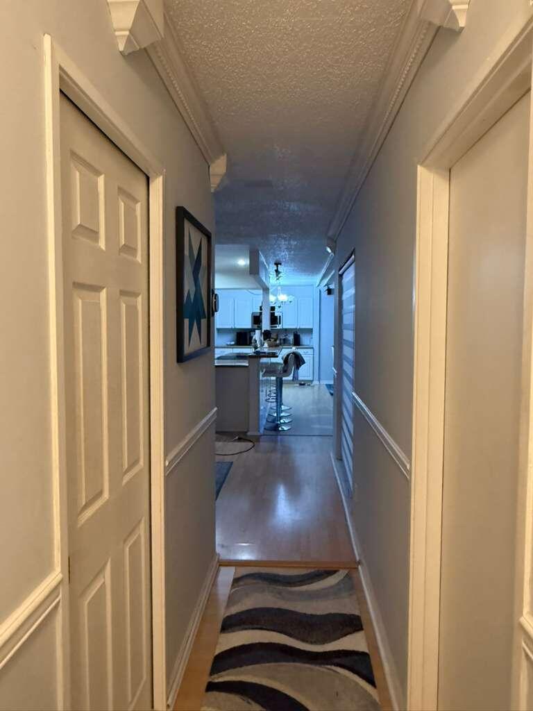 7024 Northwest 63rd Street Tamarac, FL 33321 - Photo 23 of 50 a view of a kitchen from the hallway