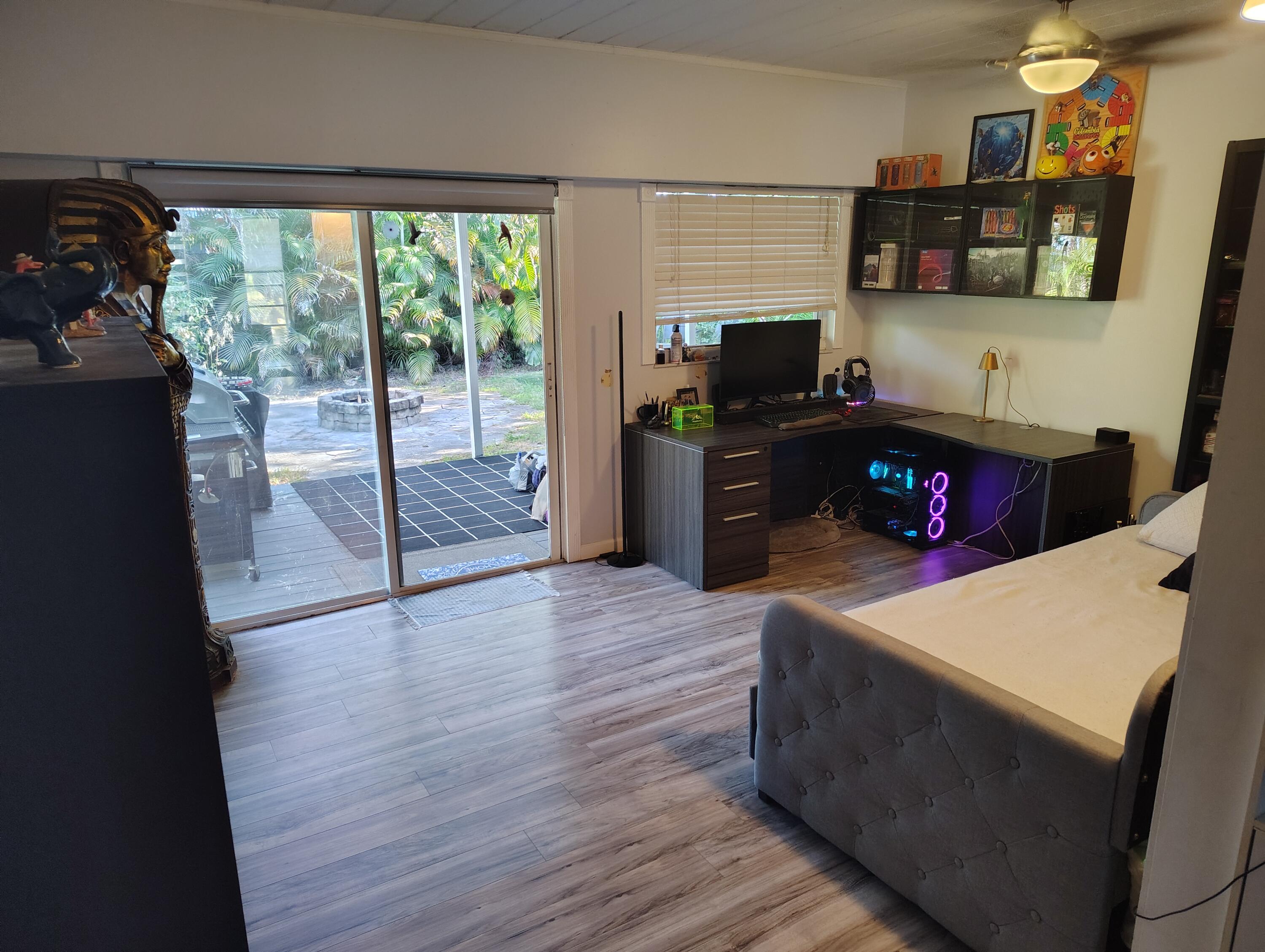 7024 Northwest 63rd Street Tamarac, FL 33321 - Photo 24 of 50 a kitchen with a refrigerator and a stove