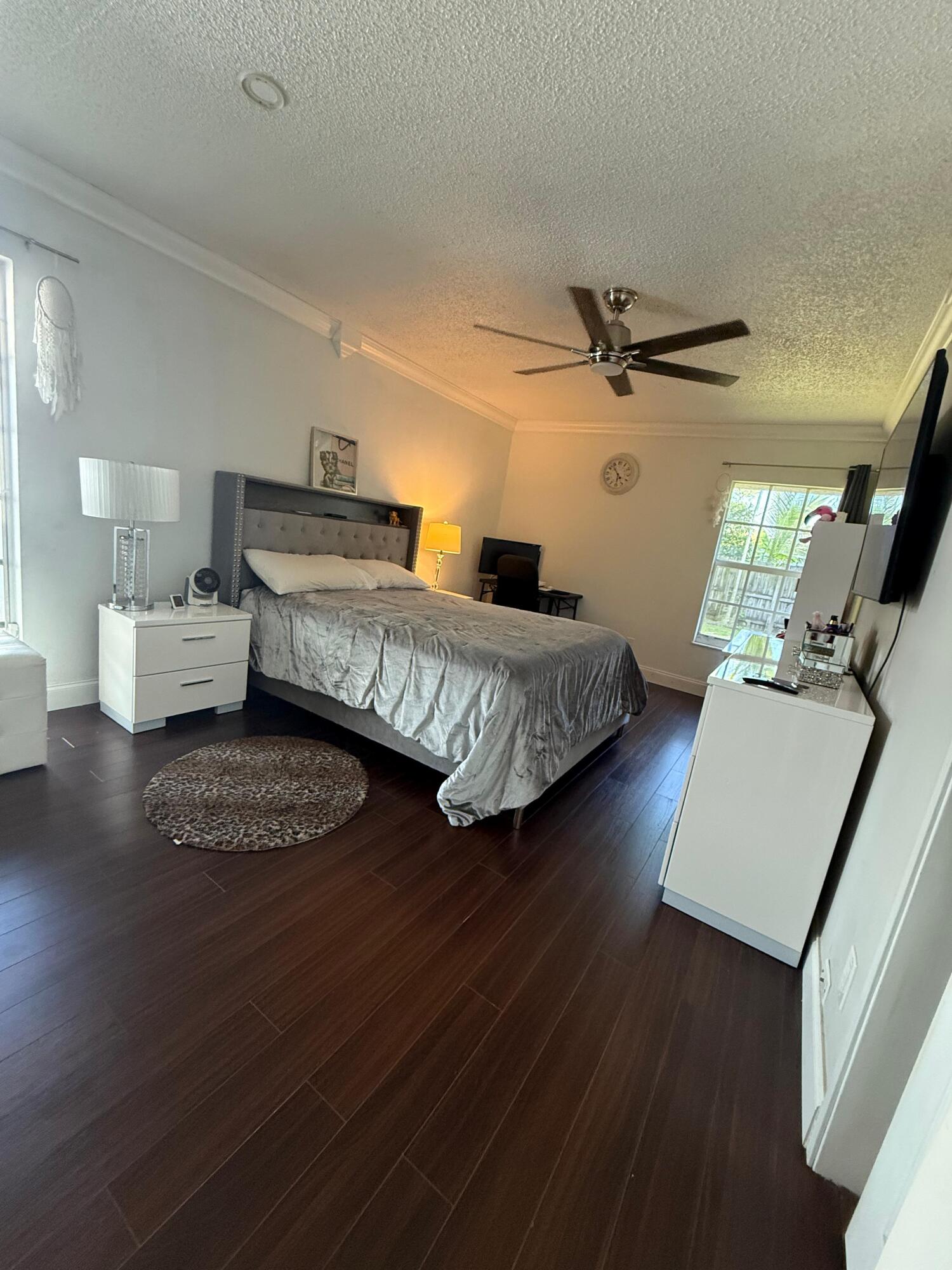 7024 Northwest 63rd Street Tamarac, FL 33321 - Photo 26 of 50 a living room with furniture and a wooden floor