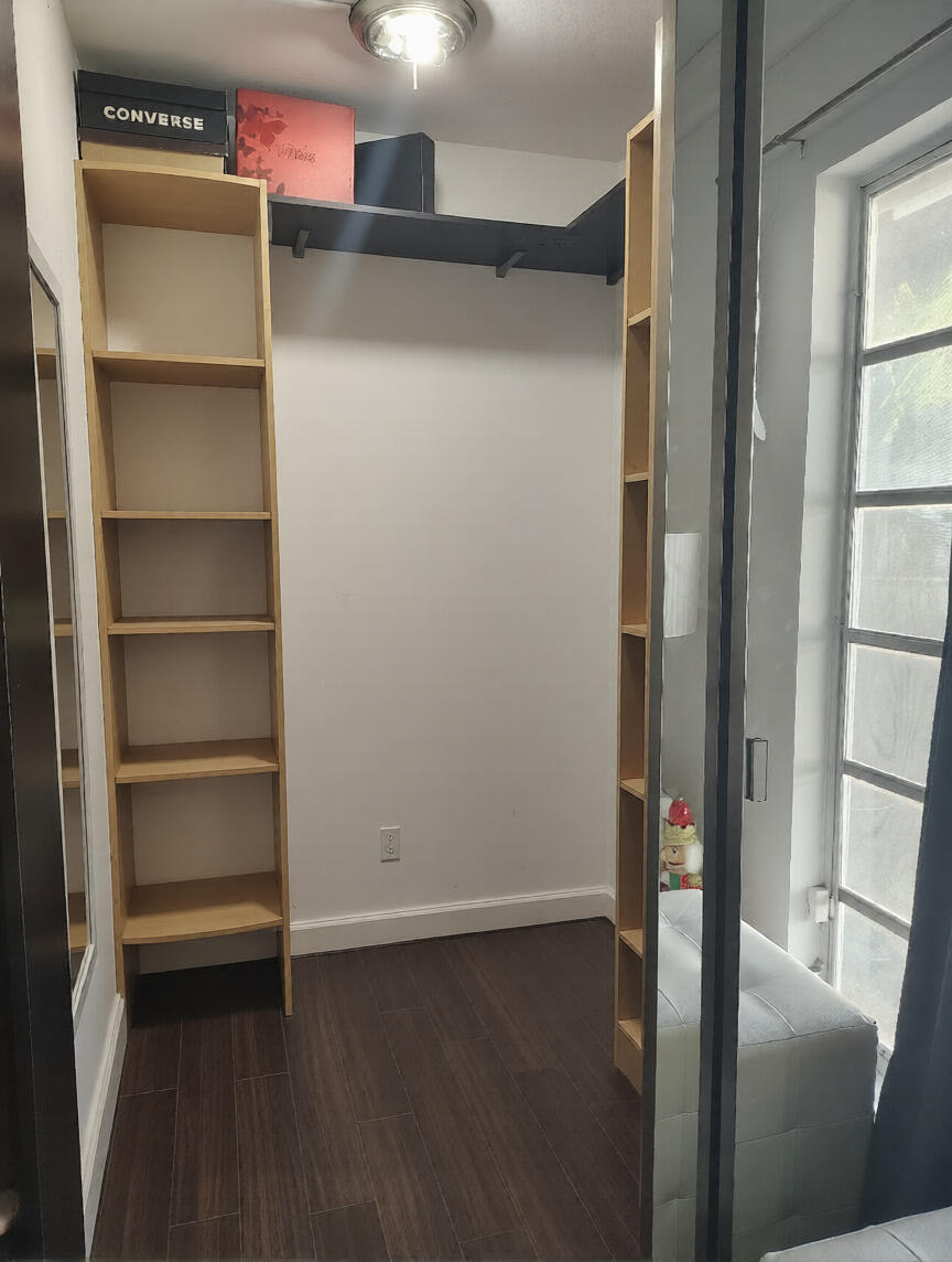 7024 Northwest 63rd Street Tamarac, FL 33321 - Photo 32 of 50 a view of a room with wooden floor