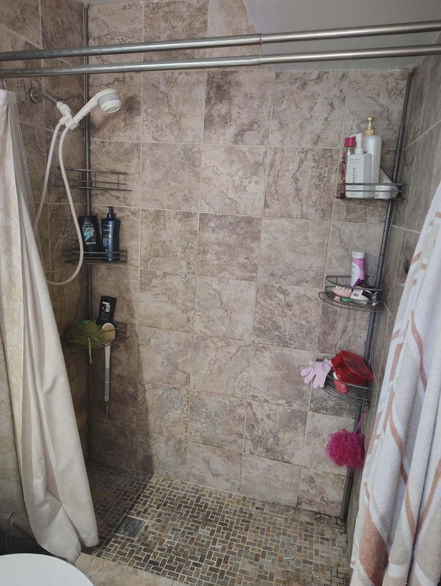 7024 Northwest 63rd Street Tamarac, FL 33321 - Photo 34 of 50 a bathroom with a shower