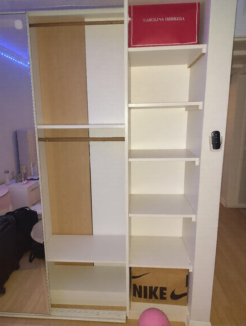 7024 Northwest 63rd Street Tamarac, FL 33321 - Photo 39 of 50 a view of walk in closet with empty racks