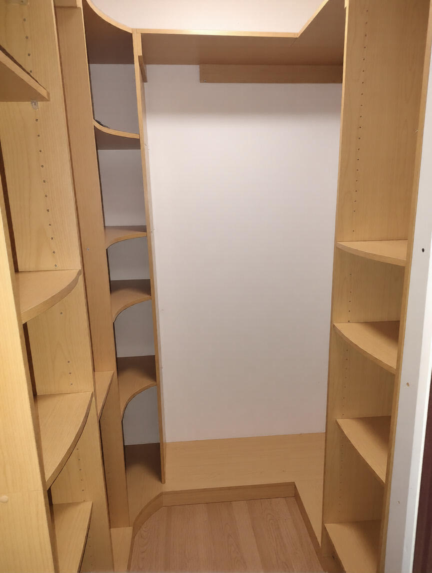 7024 Northwest 63rd Street Tamarac, FL 33321 - Photo 40 of 50 a view of walk in closet with empty racks