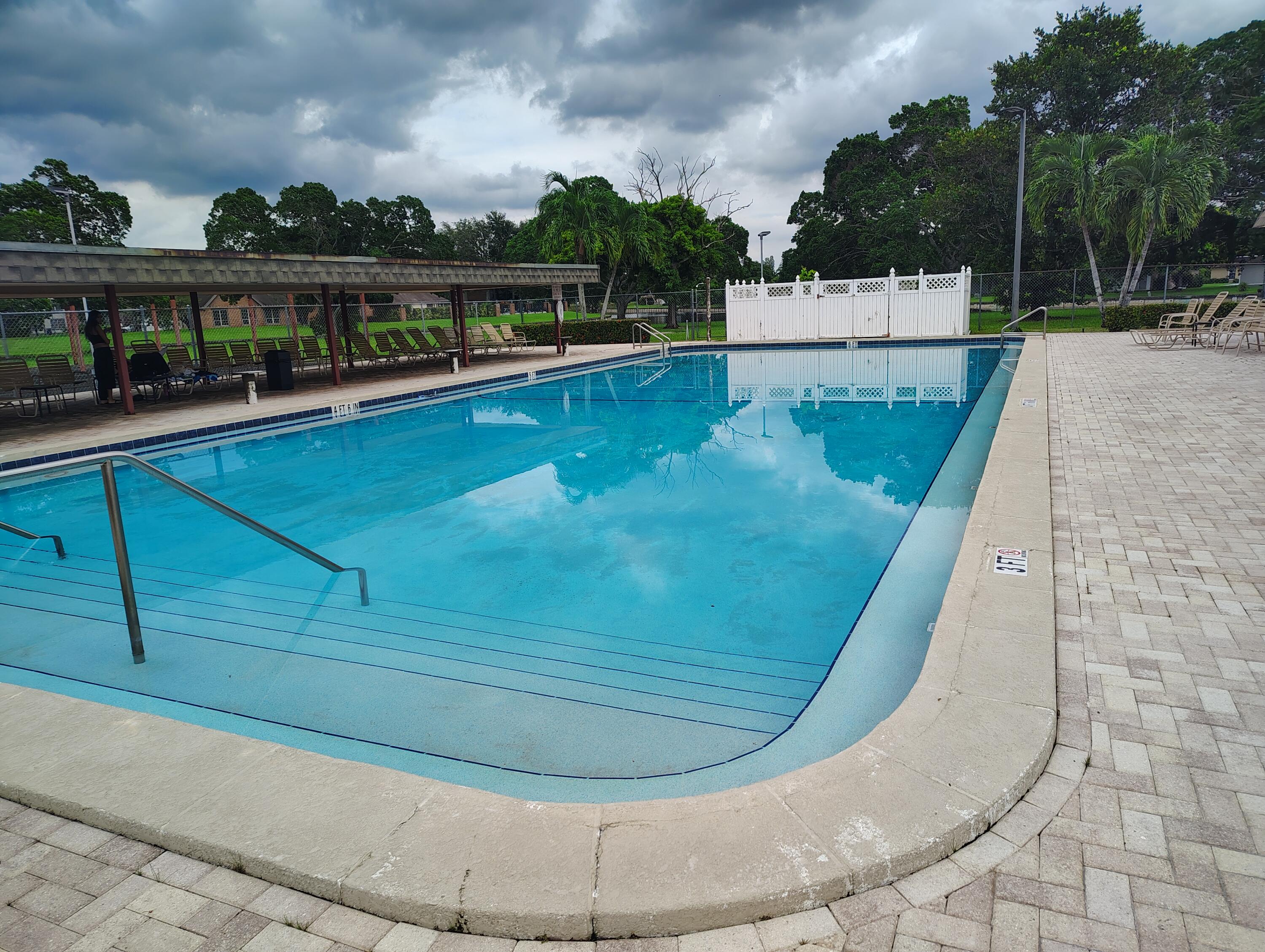 7024 Northwest 63rd Street Tamarac, FL 33321 - Photo 49 of 50 a view of a swimming pool with a balcony