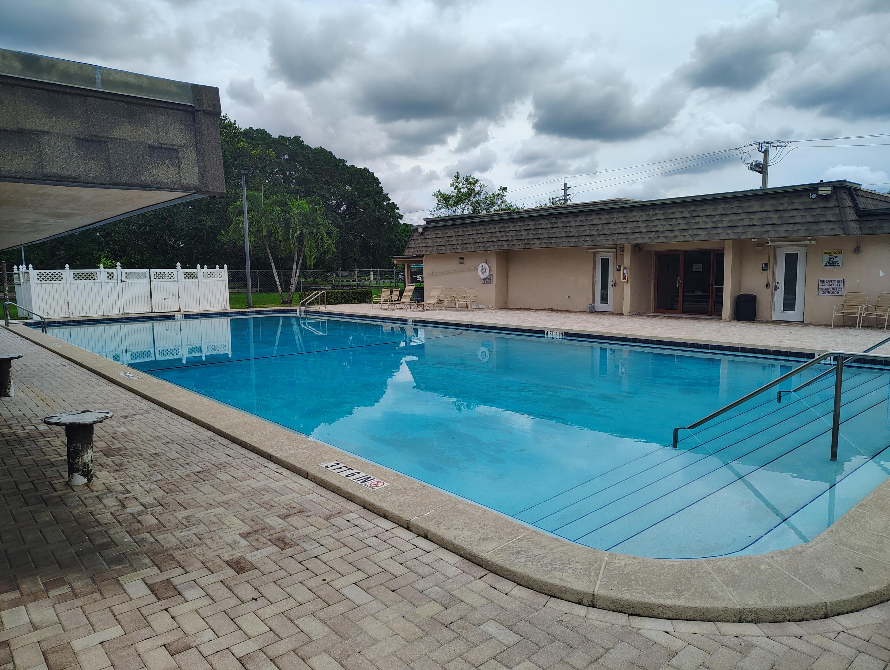 7024 Northwest 63rd Street Tamarac, FL 33321 - Photo 50 of 50 a view of a house with a backyard