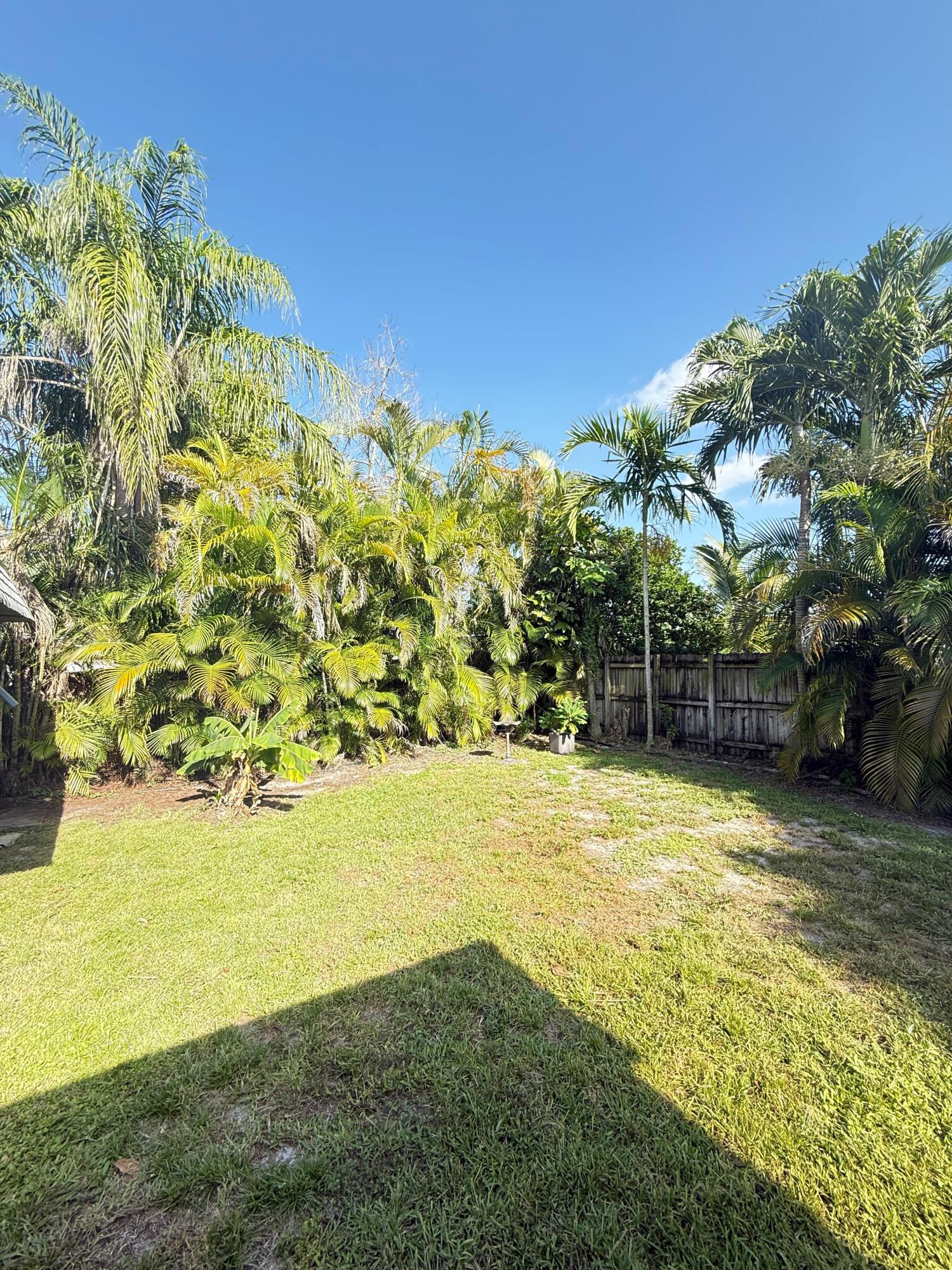 7024 Northwest 63rd Street Tamarac, FL 33321 - Photo 7 of 50 a view of yard with swimming pool and green space