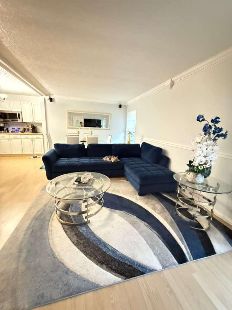 7024 Northwest 63rd Street Tamarac, FL 33321 - Photo 10 of 50 a living room with furniture and a couch