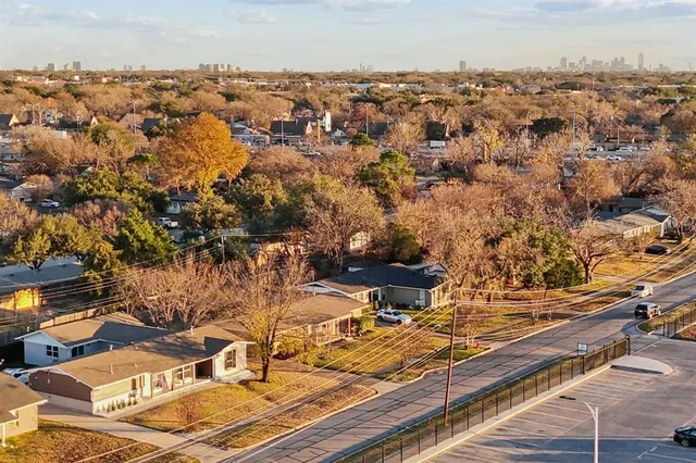 an aerial view of residential houses with outdoor space