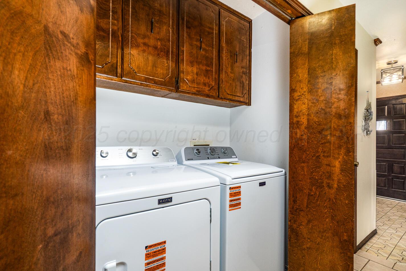 5702 South Milam Street Amarillo, TX 79110 - Photo 19 of 22 a utility room with dryer and washer