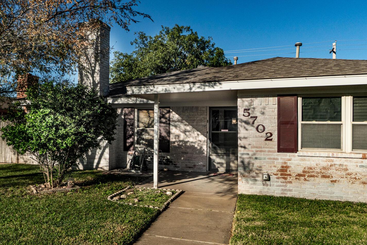 5702 South Milam Street Amarillo, TX 79110 - Photo 6 of 22 a view of a house with a yard