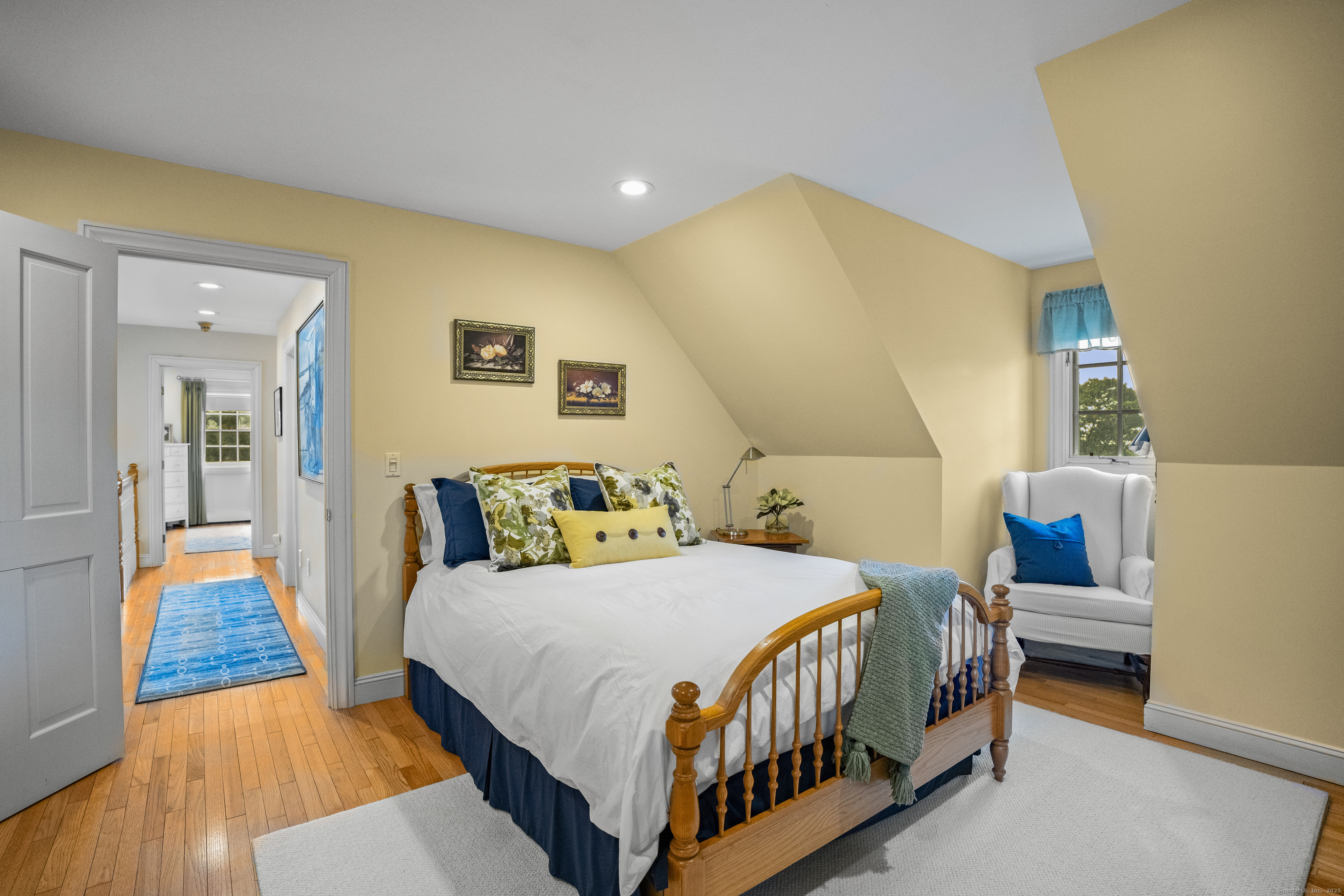 57 Northwest Corner Road Preston, CT 06365 - Photo 17 of 40 a bedroom with a bed and wooden floor