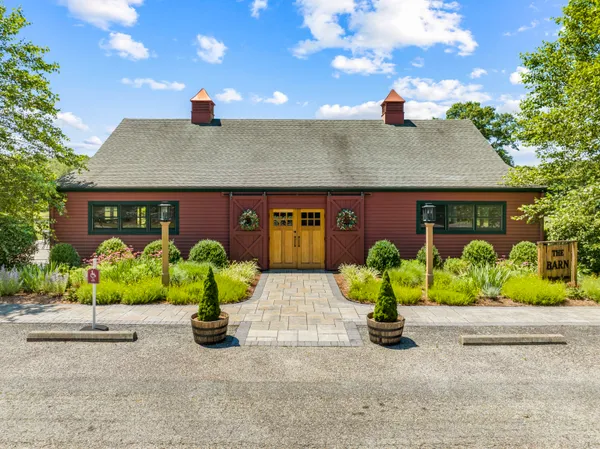 a view of a house with garden and pathway
