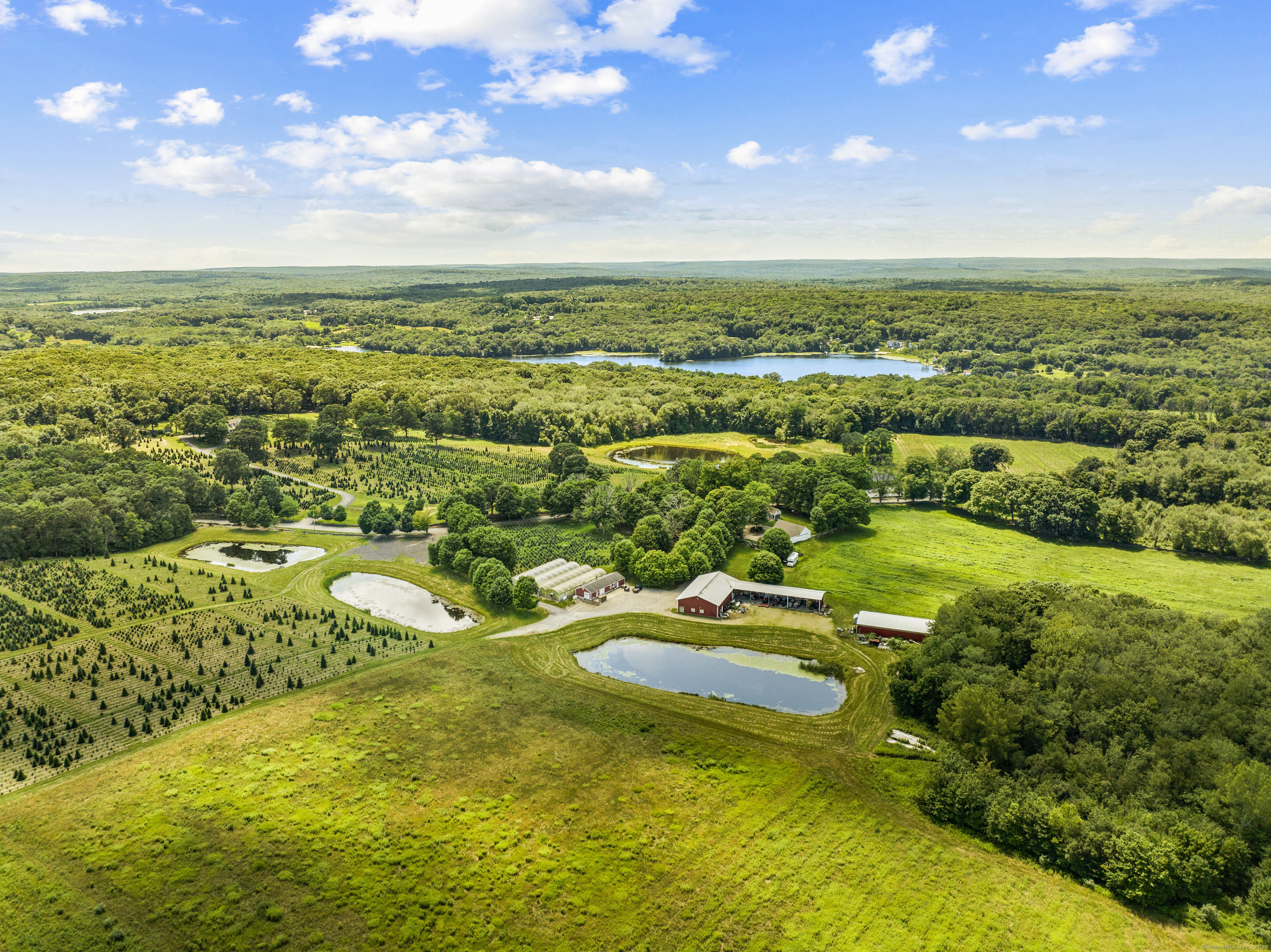 57 Northwest Corner Road Preston, CT 06365 - Photo 30 of 40 an aerial view of residential houses with outdoor space and trees