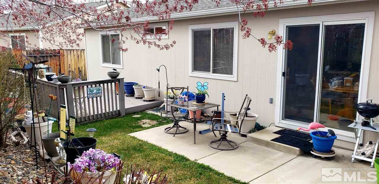 11934 Kernite Street Reno, NV 89506 - Photo 17 of 18 a view of a patio with couches table and chairs and potted plants