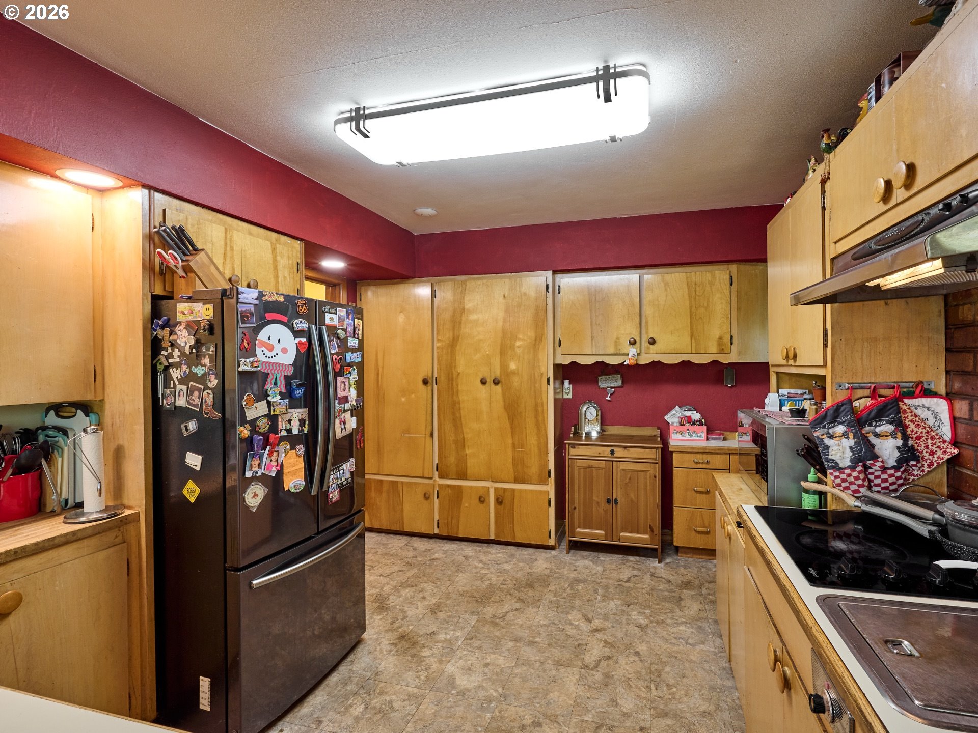 5724 South Anderson Road Aurora, OR 97002 - Photo 5 of 46 a kitchen with stainless steel appliances granite countertop a refrigerator and a sink