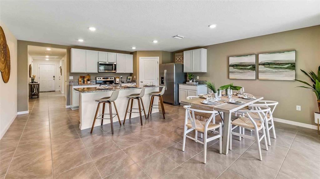 3517 Melody Gardens Place Plant City, FL 33565 - Photo 8 of 19 a view of a dining room with furniture