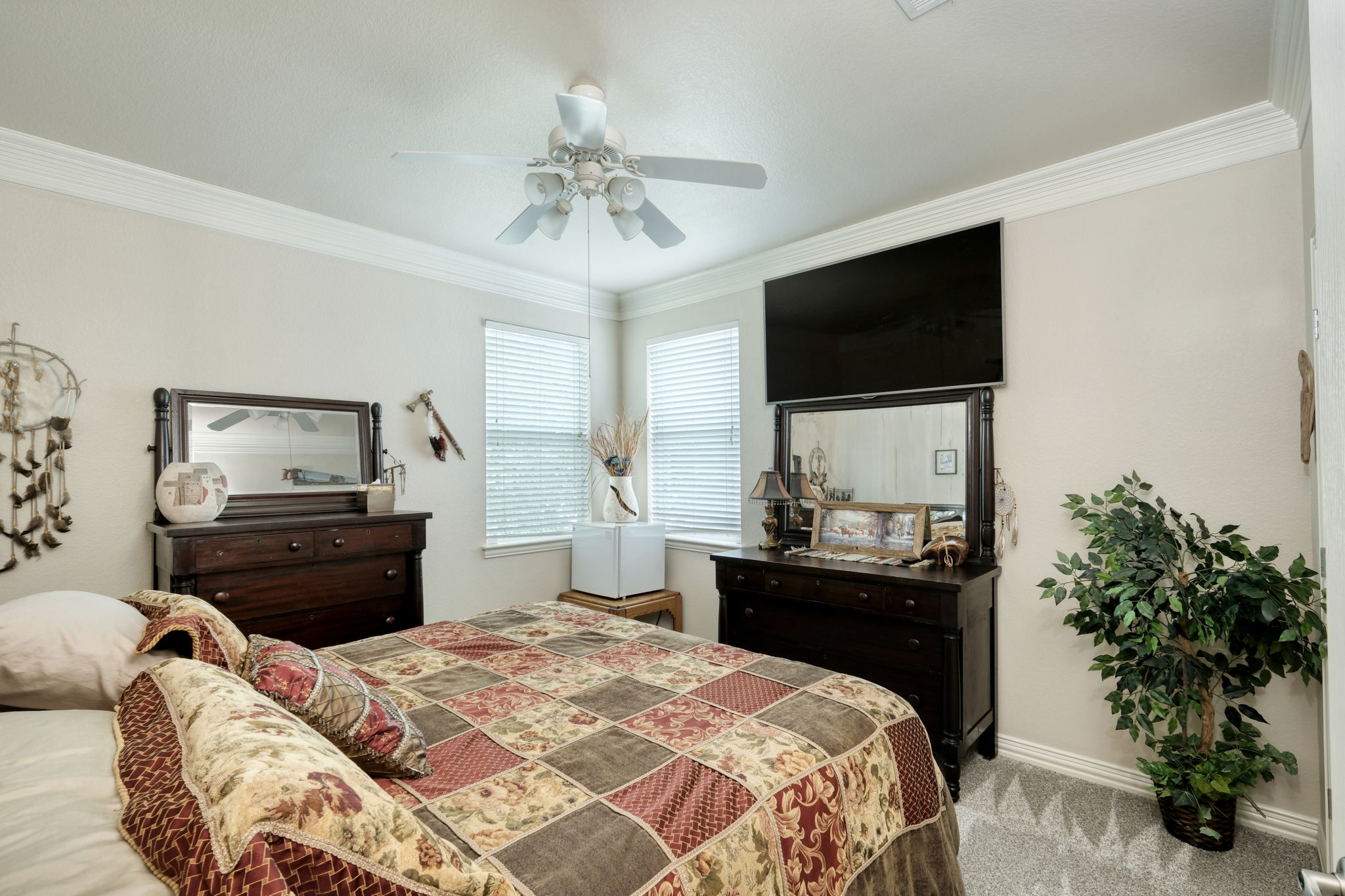 1601 Coronado Leander, TX 78641 - Photo 24 of 37 a bedroom with a bed and a flat screen tv